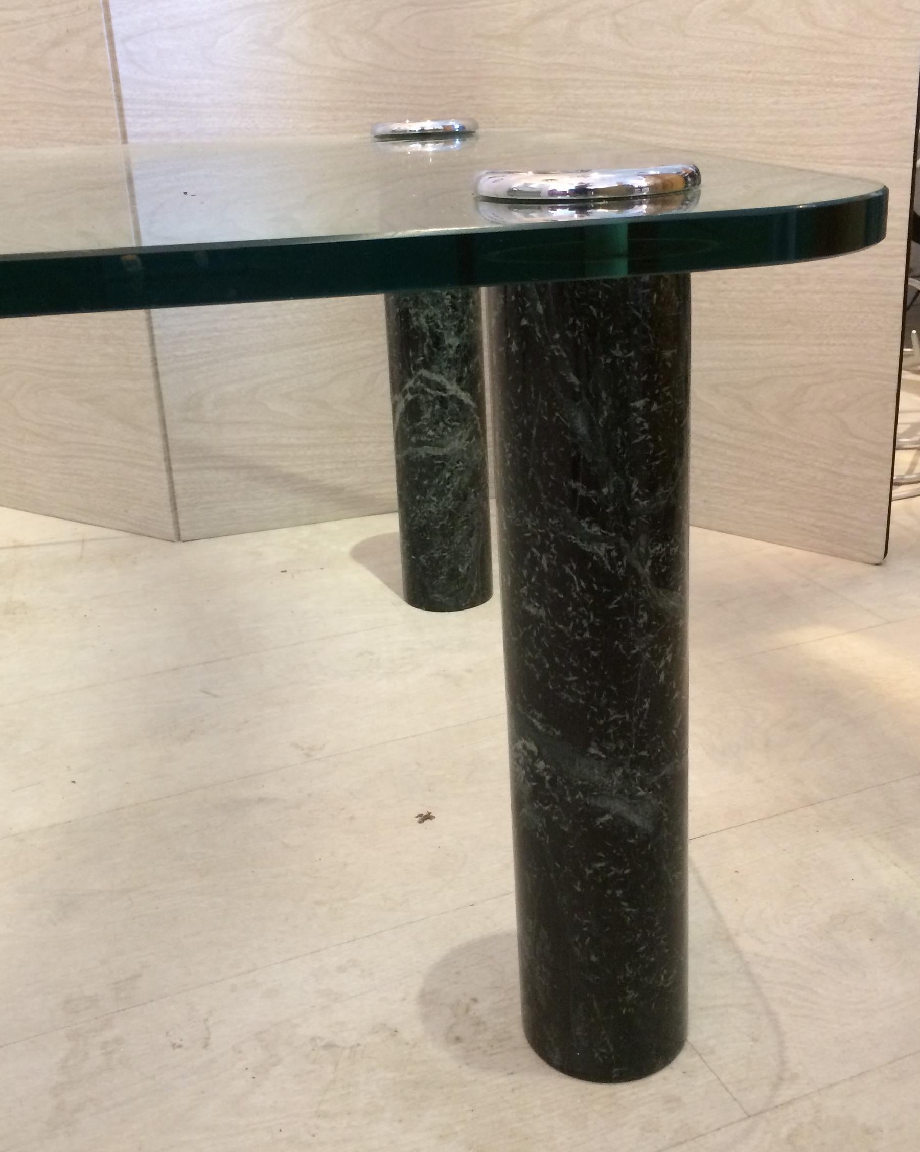 Green marble columns support a glass top coffee table attached with chrome caps. Made by Pace in the 1980s. 60 wide by 30 deep by 16 high. All in very good condition.