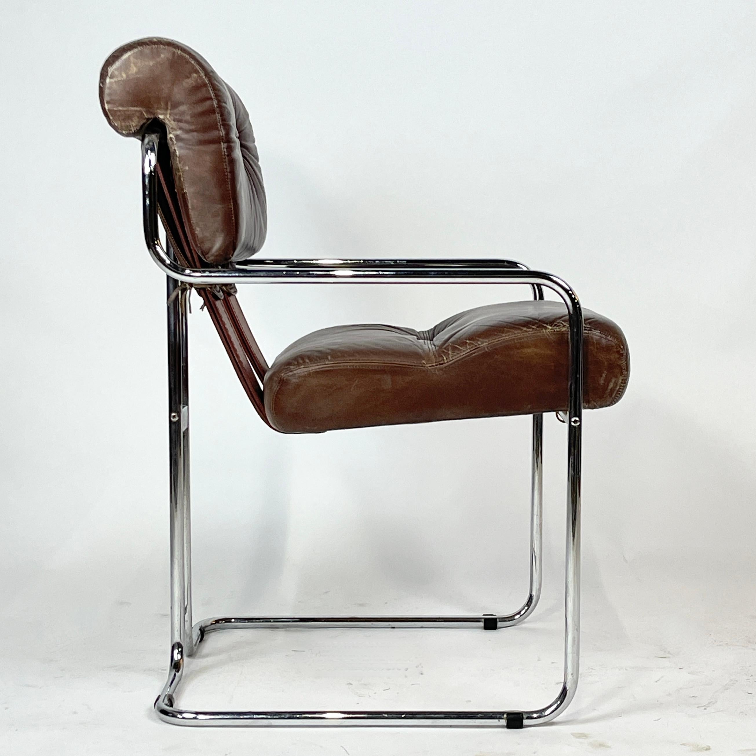 
Design: Guido Faleschini, 1971
The 'Tucroma' chair.
The simple lines of the frame enhance the craftsmanship of the stitched, tufted, and tied leather and saddle leather.

The frame is a chromed tubular steel  that gives the shape an effect of