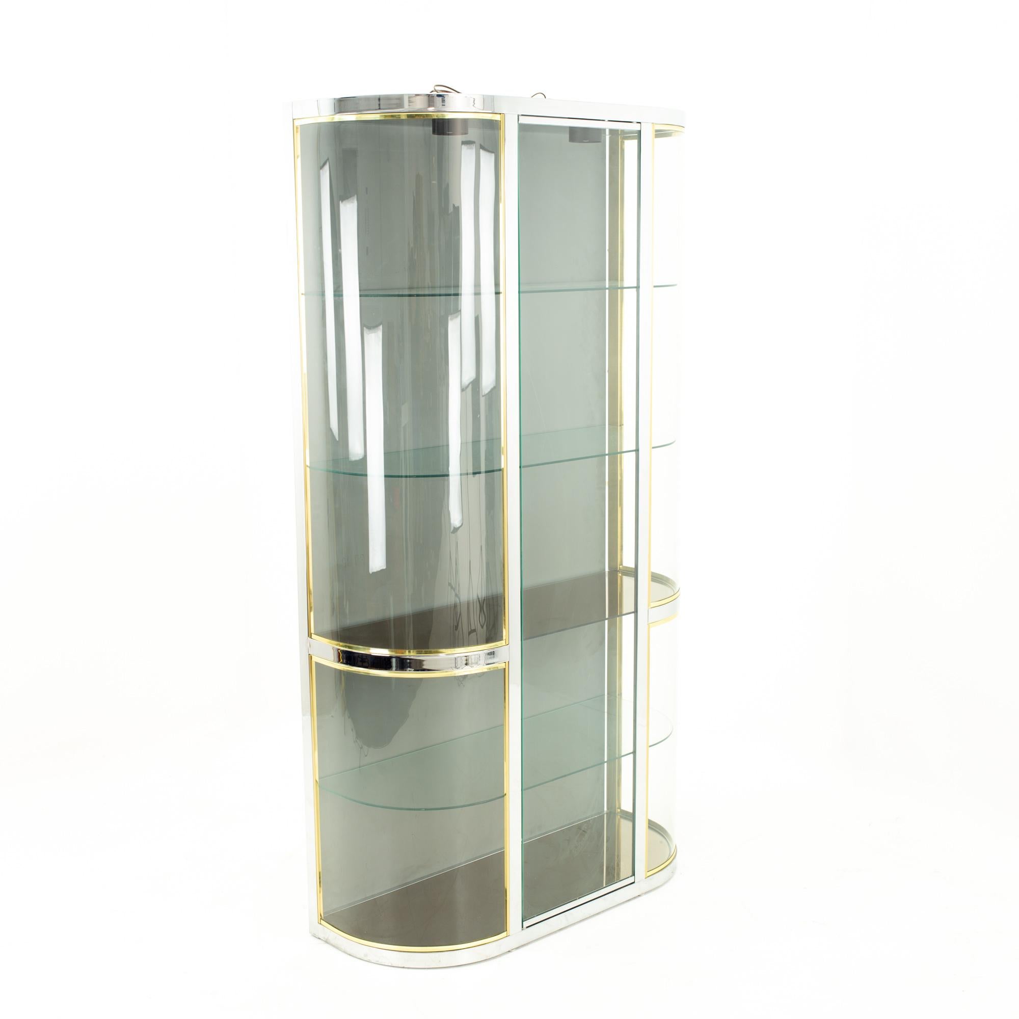 Pace Mid Century brass curved glass display case shelving
Shelving measures: 42 wide x 16.25 deep x 77.75 high
This piece is available in what we call restored vintage condition. Upon purchase, it is thoroughly cleaned and minor repairs are made -