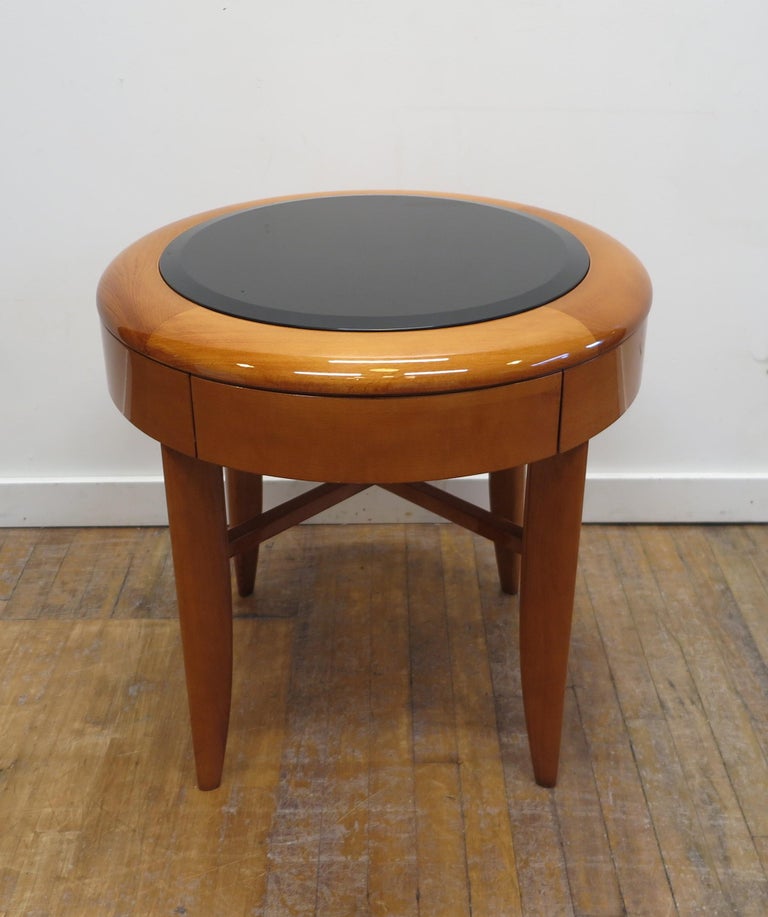 Pace round side table in Cherry with X base and inset beveled glass top by Adam Tihany for The Pace Collection. Having one drawer. Signed and numbered No 1614, American 1980's in very good condition.