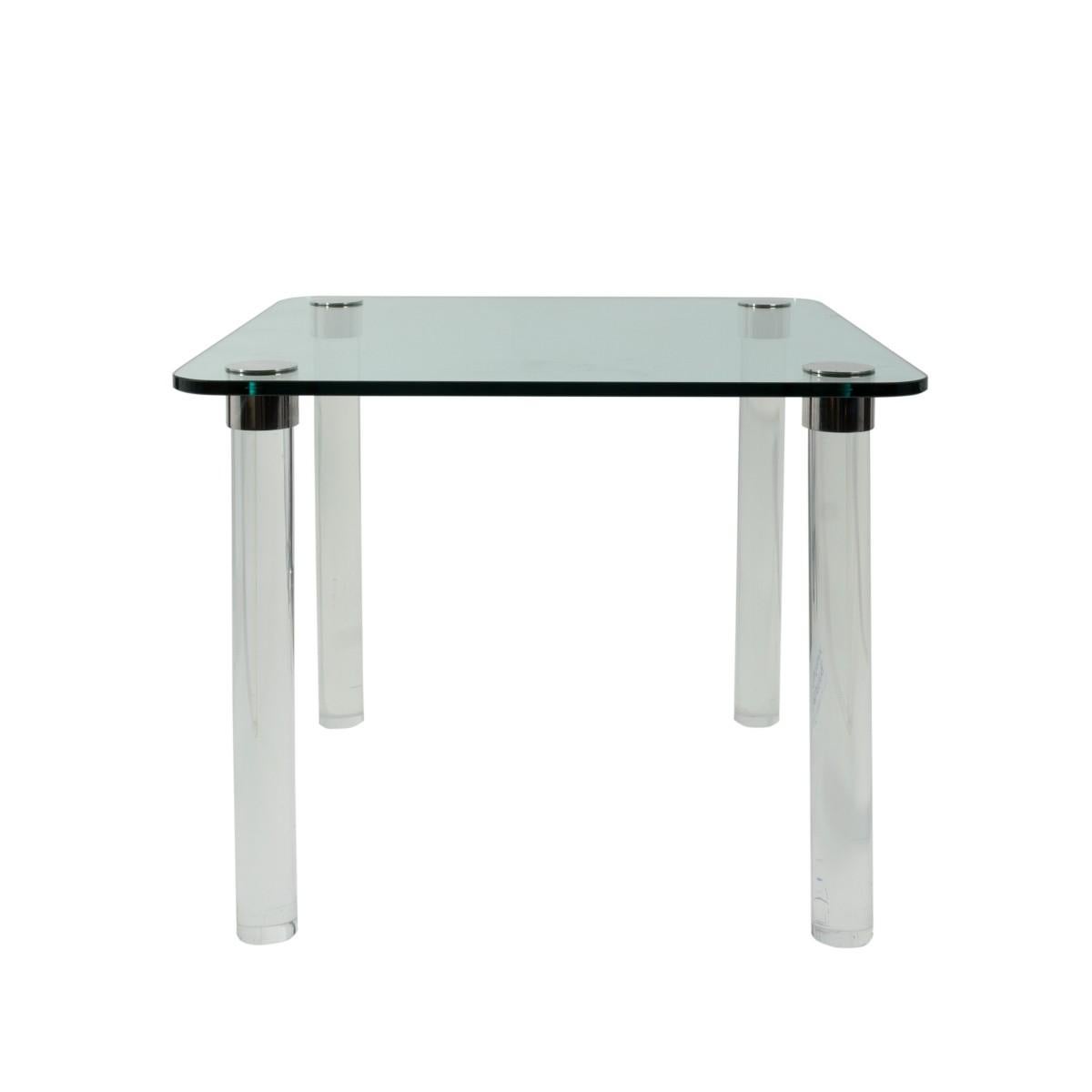 A Pace style dining or card table with a square glass top, Lucite legs and chrome fittings, USA, circa 1970.
     