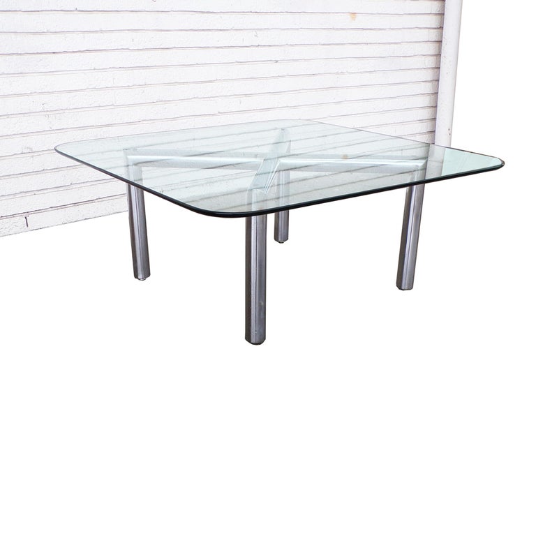 Pace style chrome coffee table

Unusual version of an x base frame table with polished chrome tubular legs and a glass top. Top measures 24