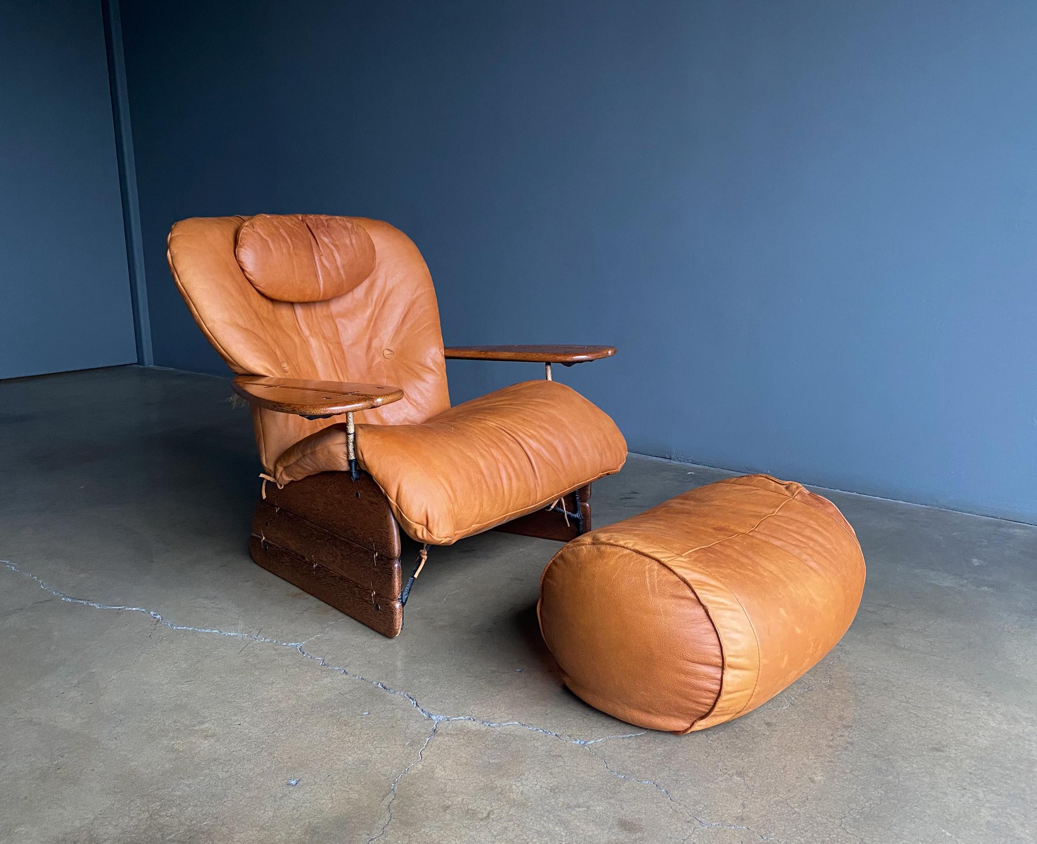 Pacific green Cognac leather & palmwood Havana lounge chair & ottoman, 1990's. Nice original patina. Perfectly broken in. A really comfortable chair. 

The ottoman measures: 30