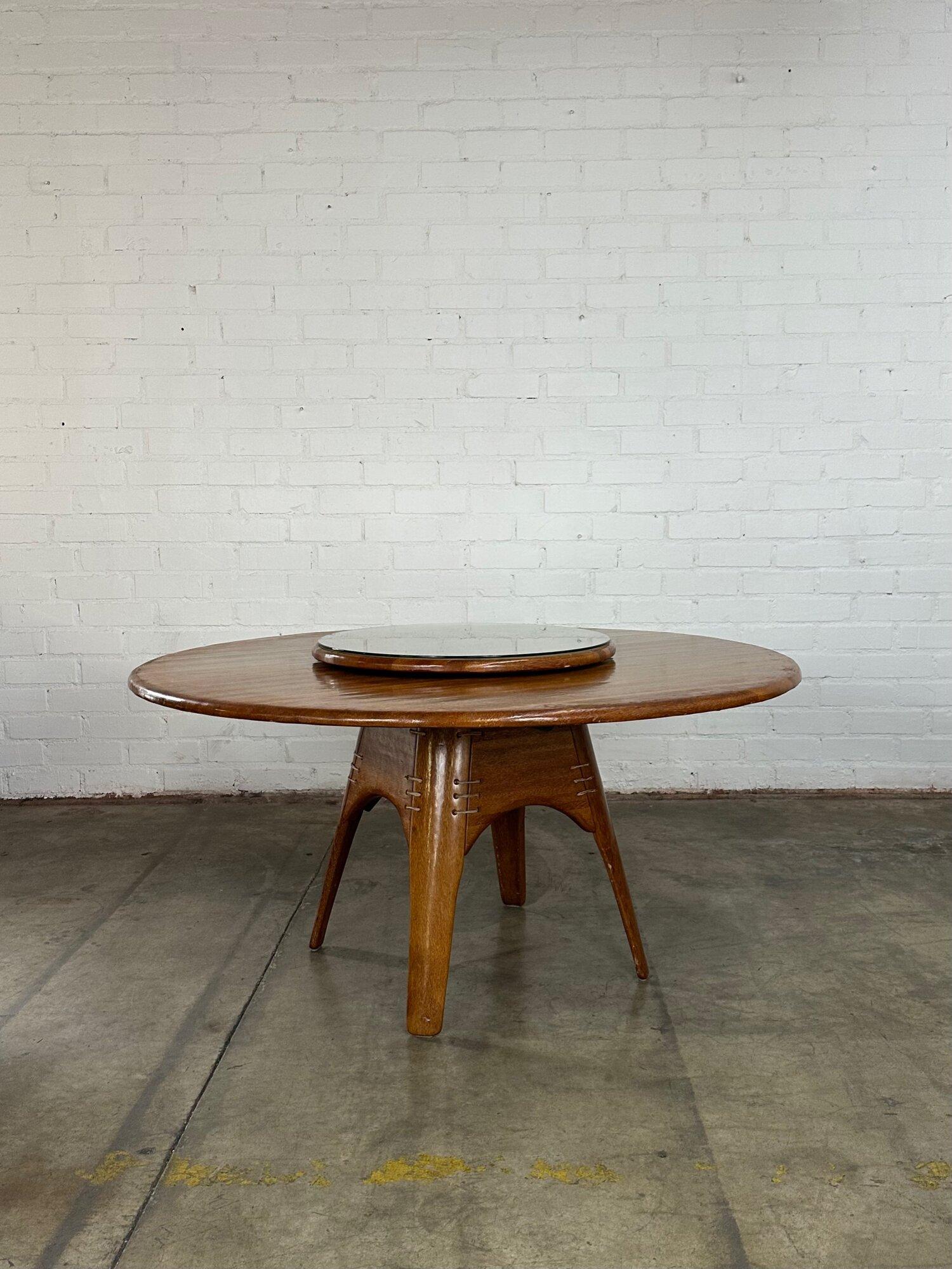 W58 D58 H28.5 KC27.75

top piece W26.5 H2

Vintage Palm wood dining table in great gently used condition. Table has a glass surface to protect table from everyday use and a removable matching lazy Susan and glass. Item is structurally sound and