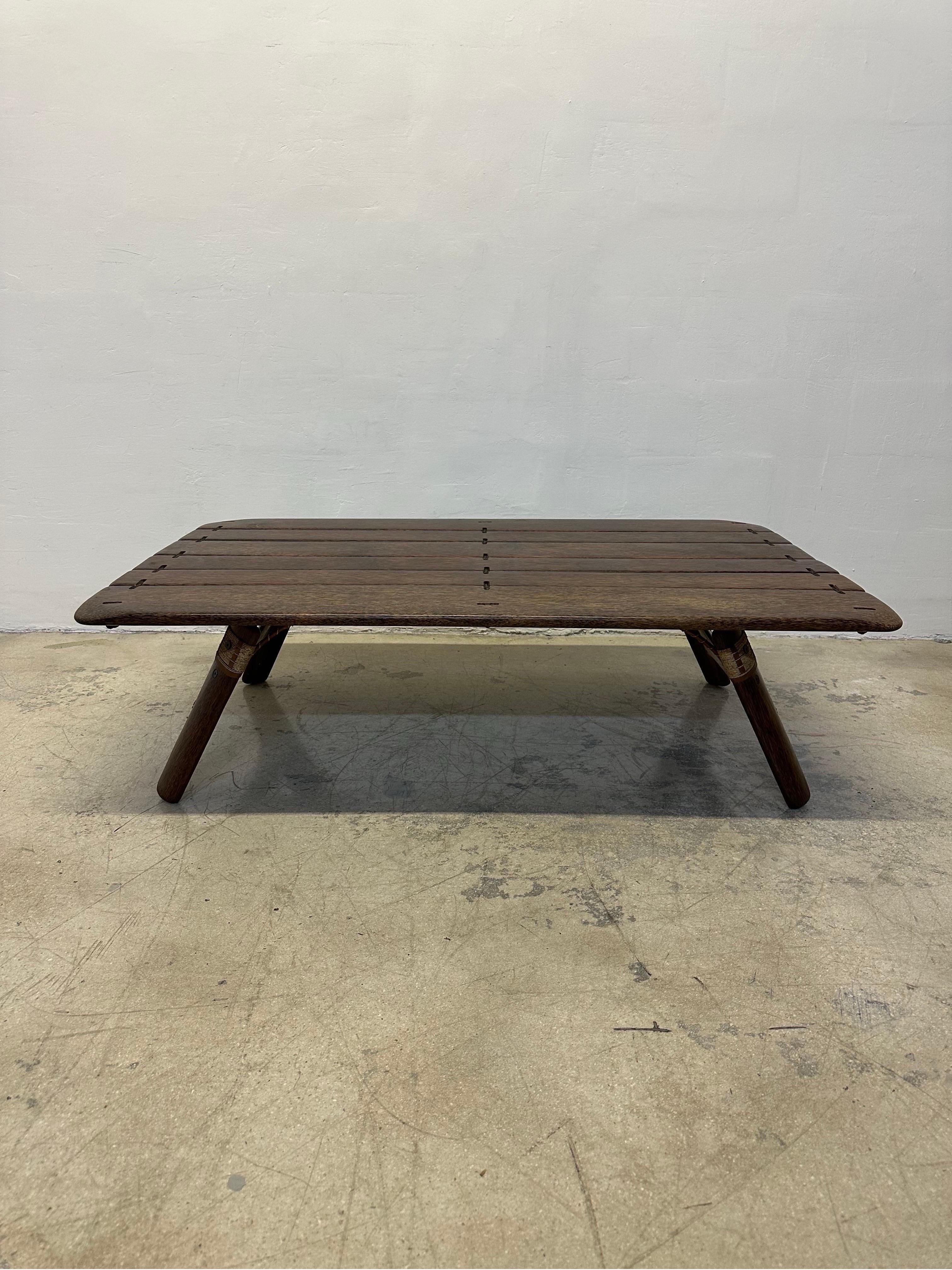Pacific Green’s Navajo coffee table constructed from Palm hardwood, jute, iron and leather. Circa 2000s.  Pacific Green is a sustainable furniture manufacturer and developer of Palmwood, a durable hardwood made from discarded Coconut palms.