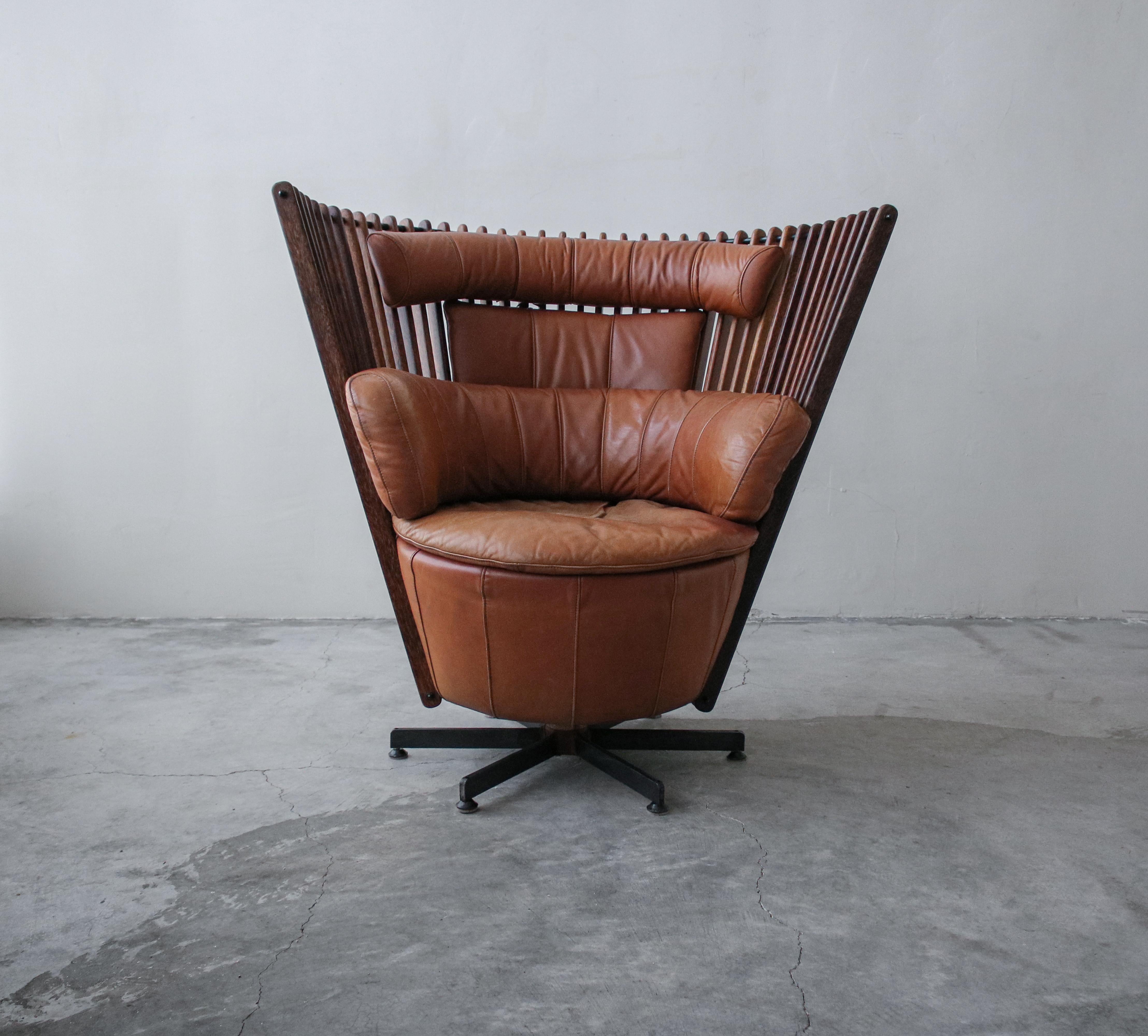 A beautiful chair designed by Pacific Green. Chair is in excellent condition. Leather shows patina from age and use, but no damage, please see images.

