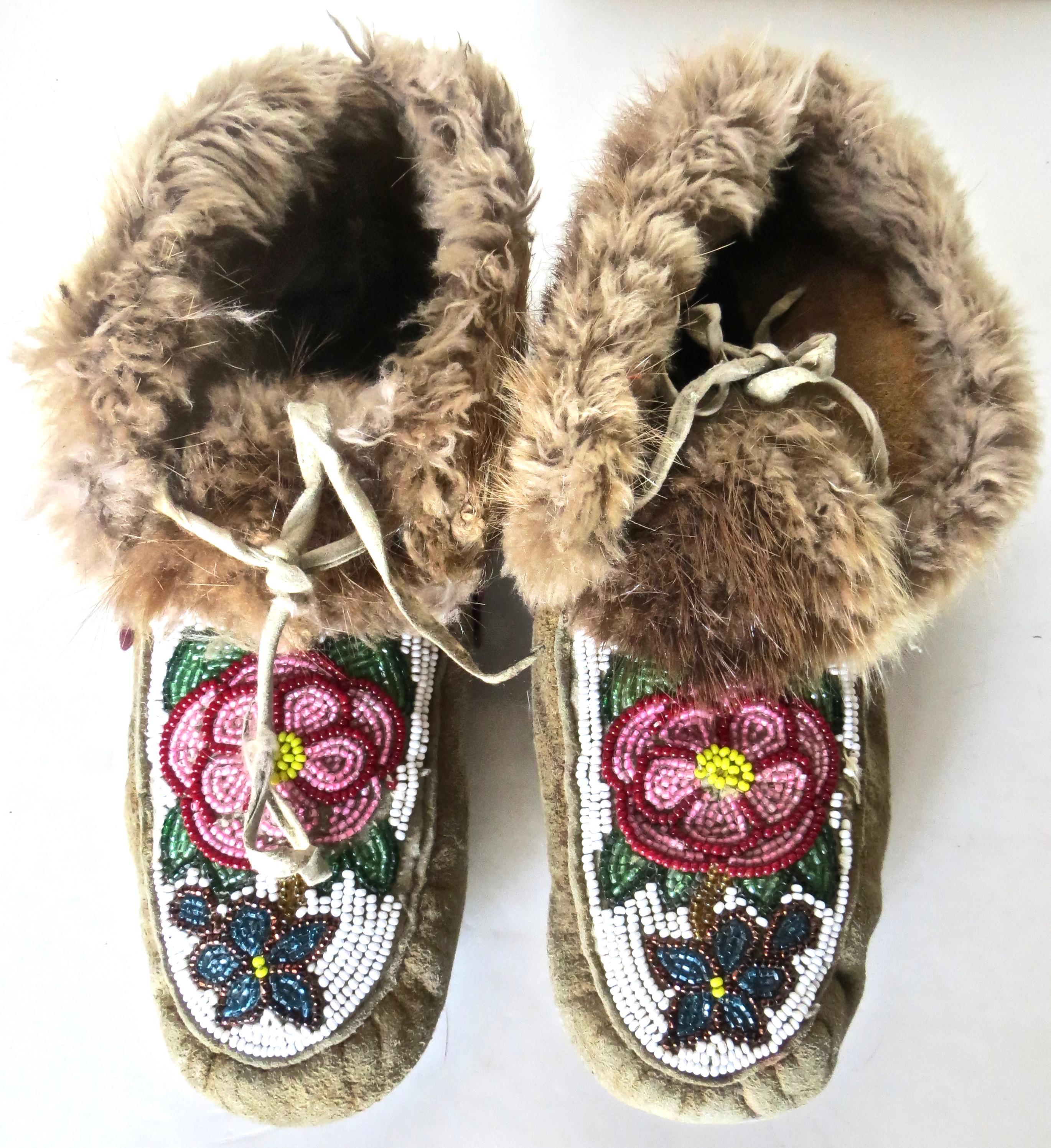 Pair of Native American Indian adult sized moccasins, likely from the Pacific northwest tribe, the Makah Indians, who inhabited the Olympic peninsula. They lived in a colder climate and were noted for whaling. This accounts for their use of fur