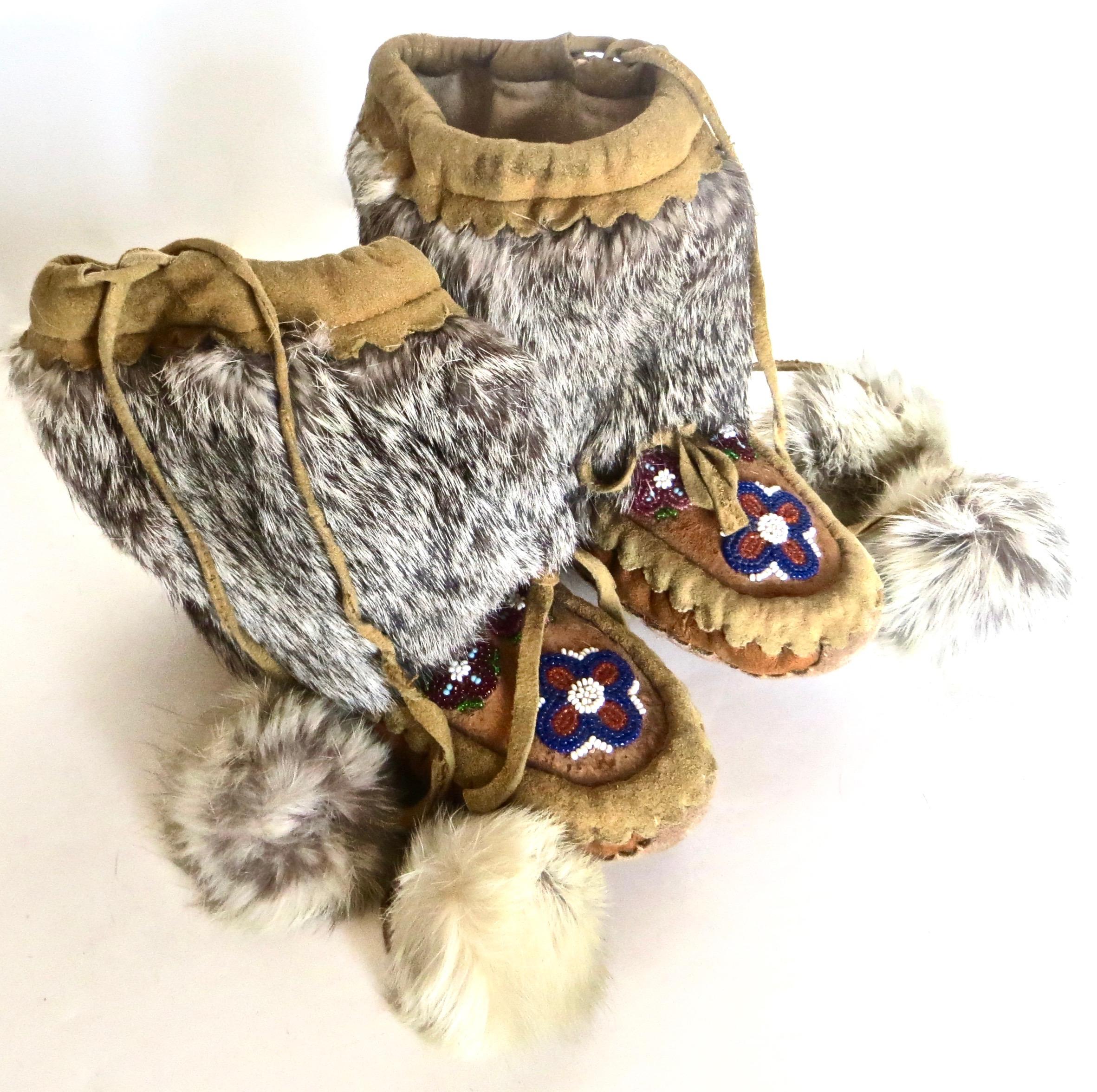 Pair of Native American Indian child sized moccasins, likely from the Pacific northwest tribe, the Makah Indians, who inhabited the Olympic peninsula. They lived in a colder climate and were noted for whaling. This accounts for their use of animal
