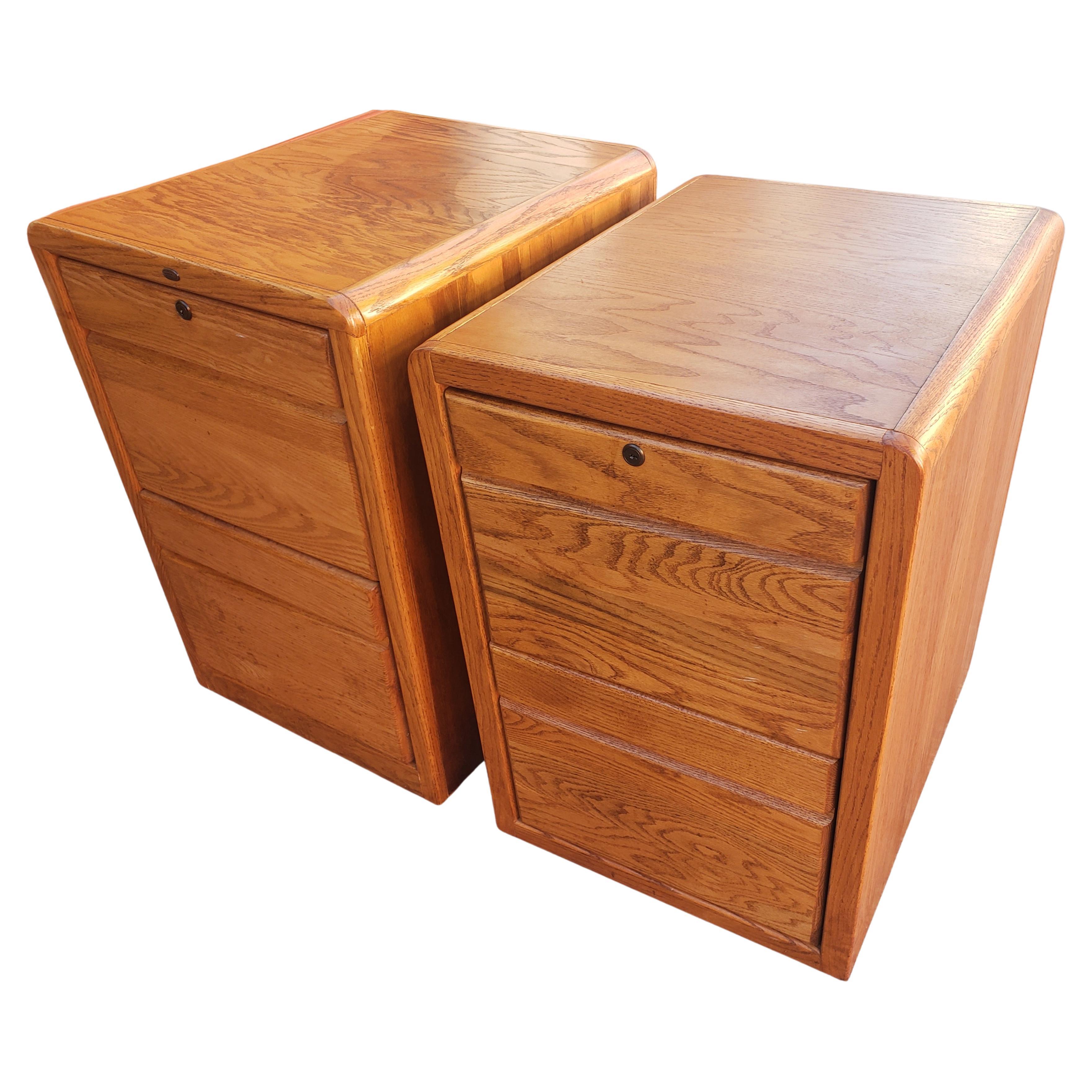 Two drawer oak tambour legal and letter size filing cabinets by Pacific Tambour. Measurements are 20