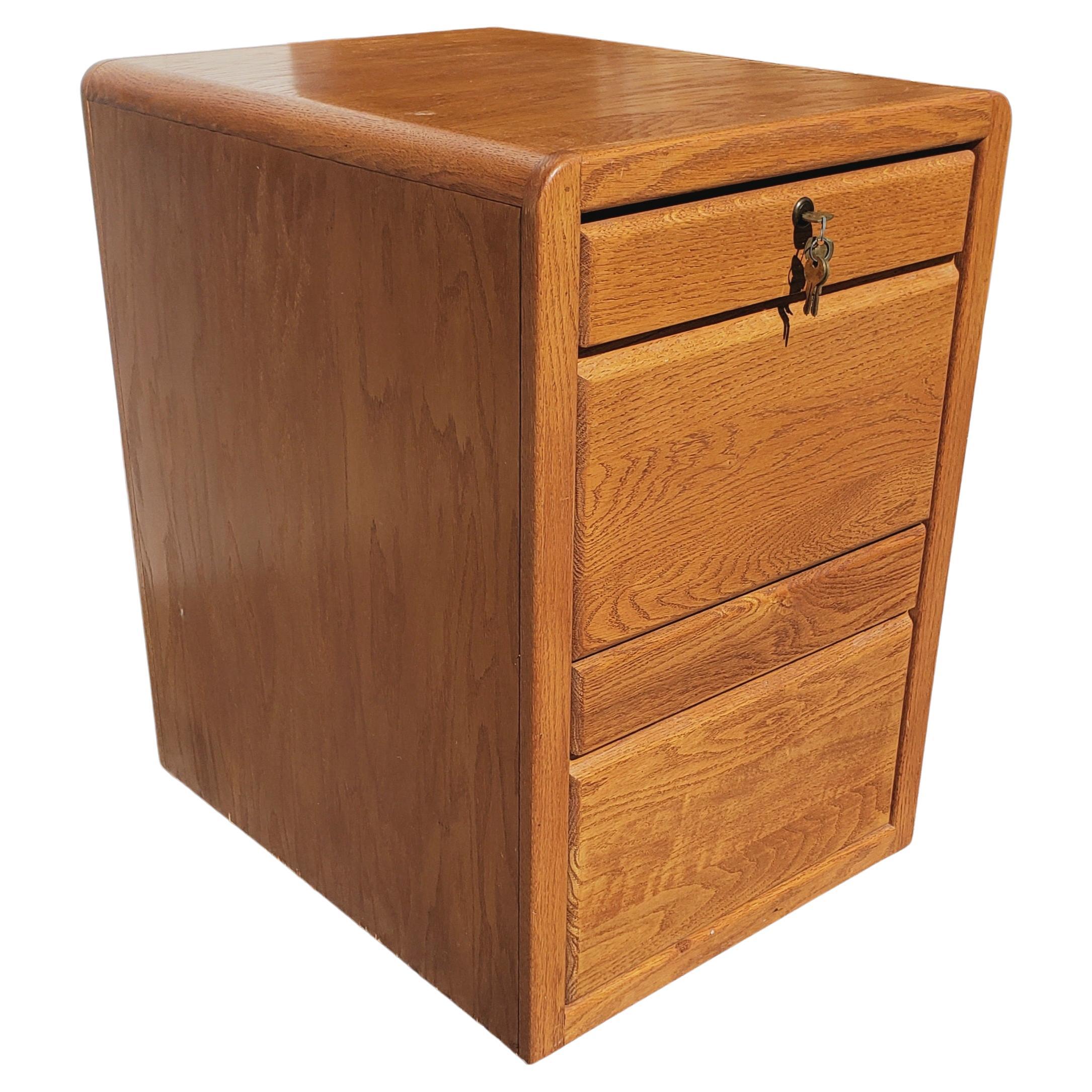 Vintage Two drawer oak legal and letter size filing cabinet by Pacific Tambour. Measurements are 20