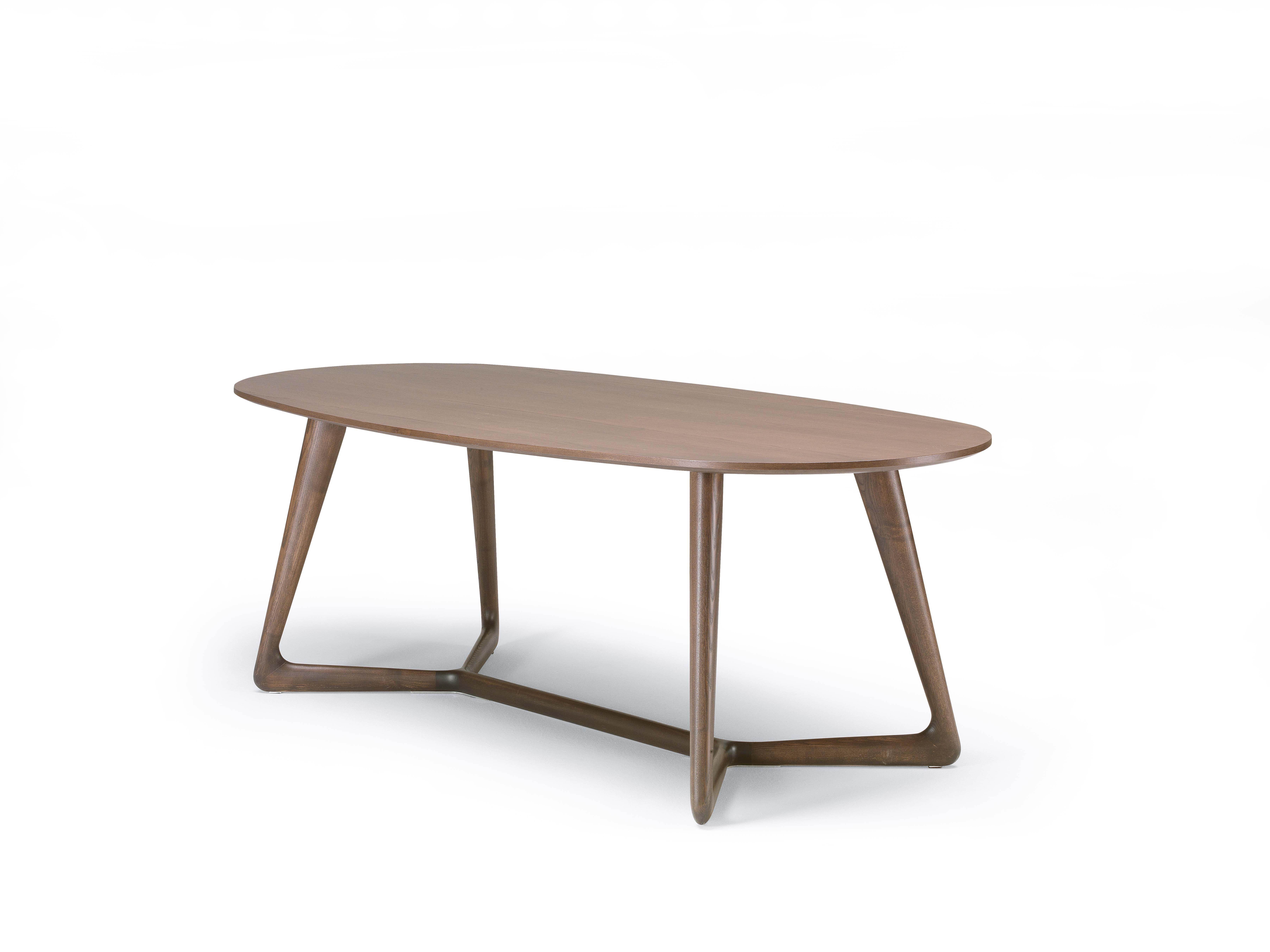 Oval dining table with structure in solid ash and top veneered ash. Details in polished aluminium. Available finishings: FN natural ash, WG wengé, NC walnut, TB tobacco, open pore matte lacquered (L21 white, L29 pearl, L23 cappuccino color, L25