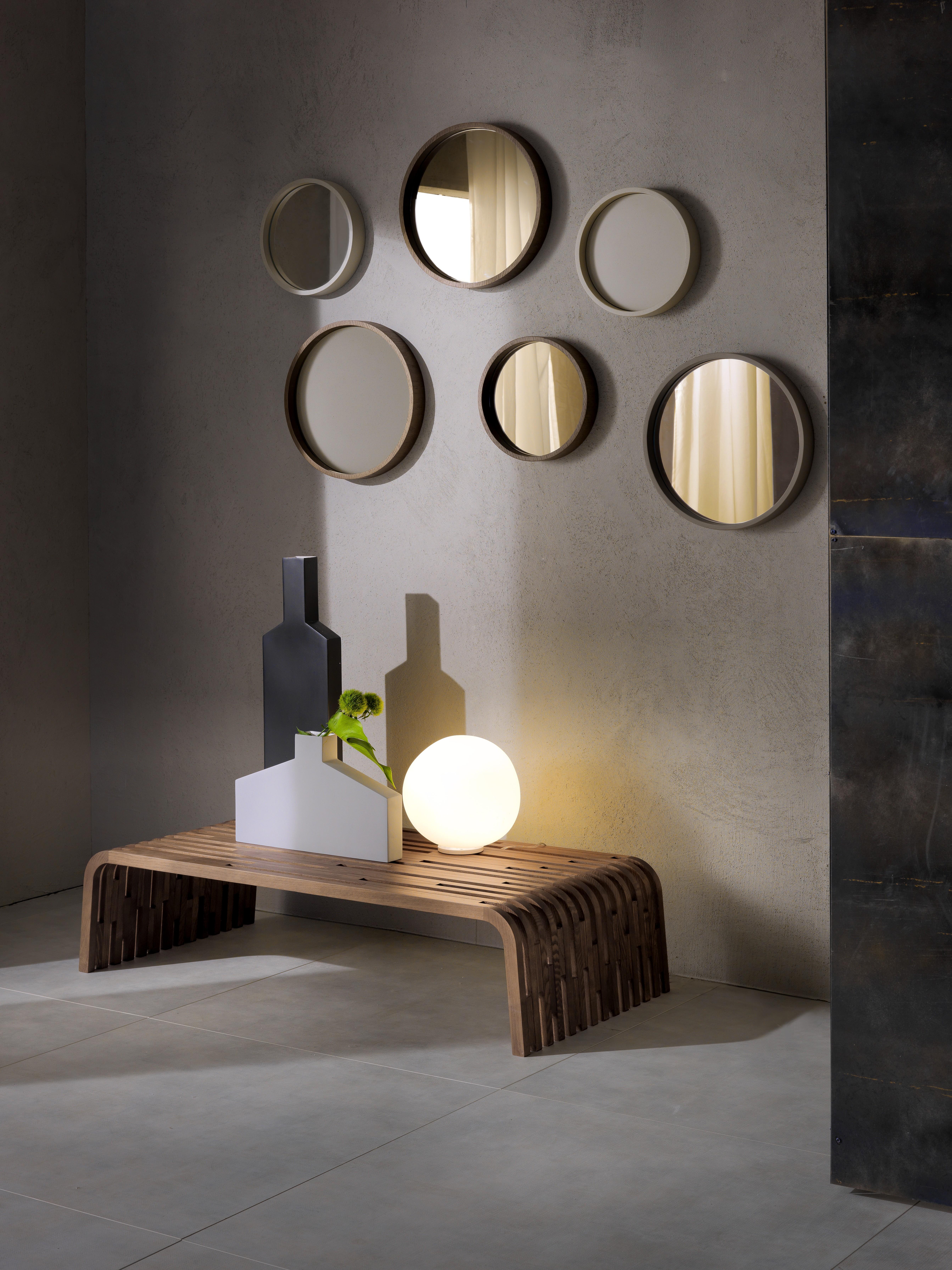 Wall mirror with veneered or lacquered frame. Assembling possible in different configurations. Available finishings: wengé, walnut, tobacco, open pore matte lacquered (white, pearl, cappuccino, smoke grey, black, red), closed pore matte lacquered