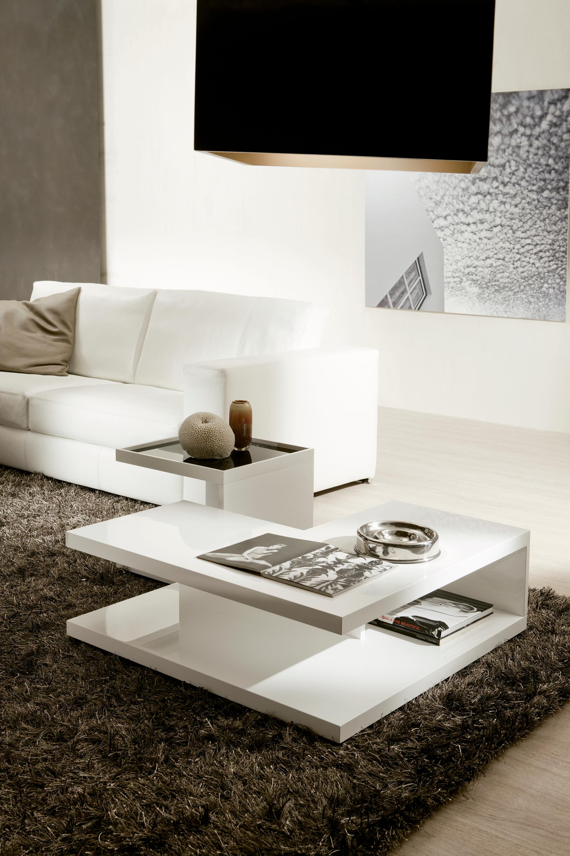 Coffee table with veneered surfaces. Serving table with top in lacquered glass (extra light white, black or moka) and veneered shelf.