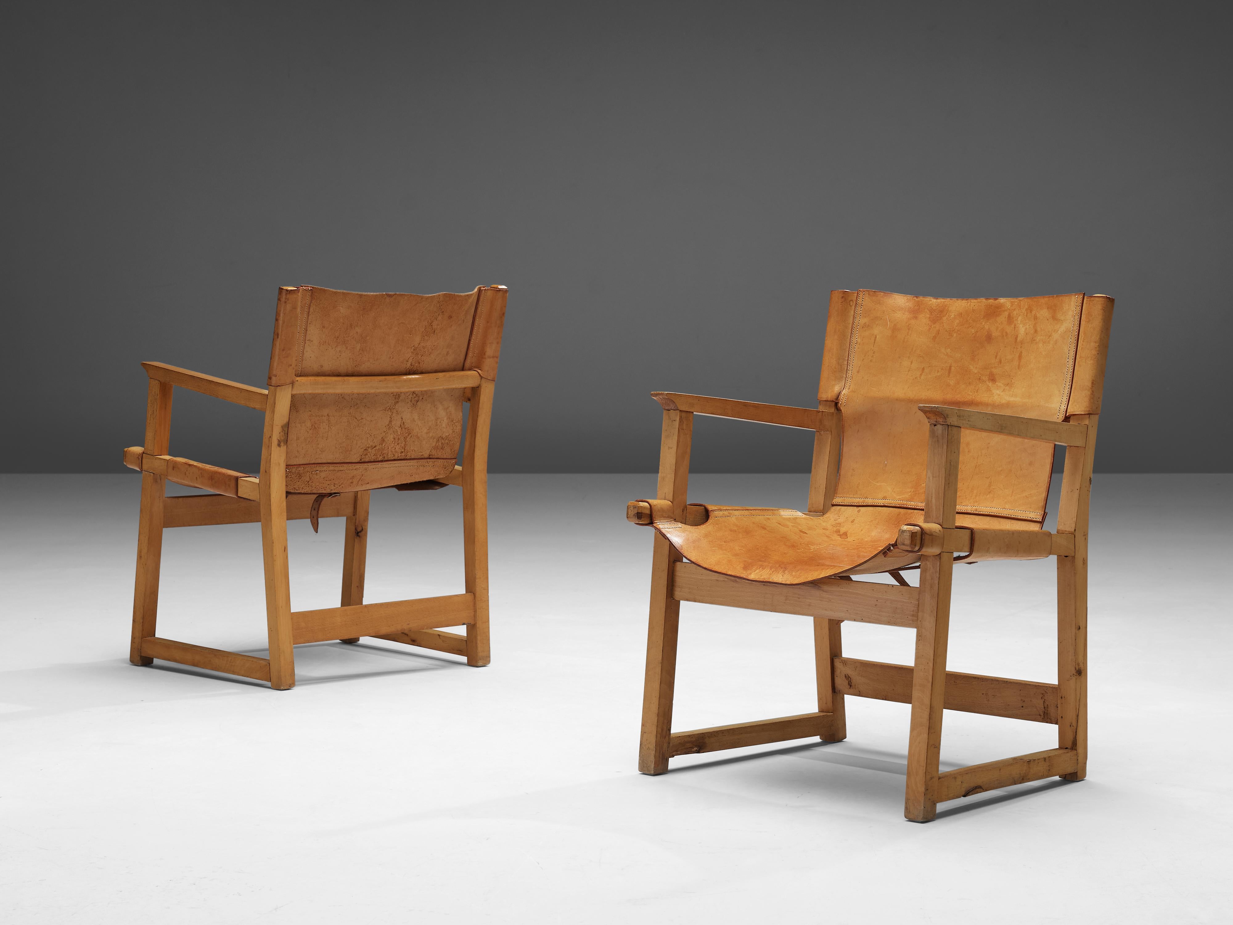 Paco Muñoz, paire de fauteuils, cuir, hêtre, Espagne, années 1950

Fauteuils Safari ou 