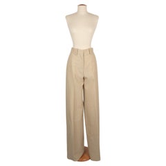 Pantaloni Paco Rabanne in misto lana beige e fili di lurex dorati, 2024