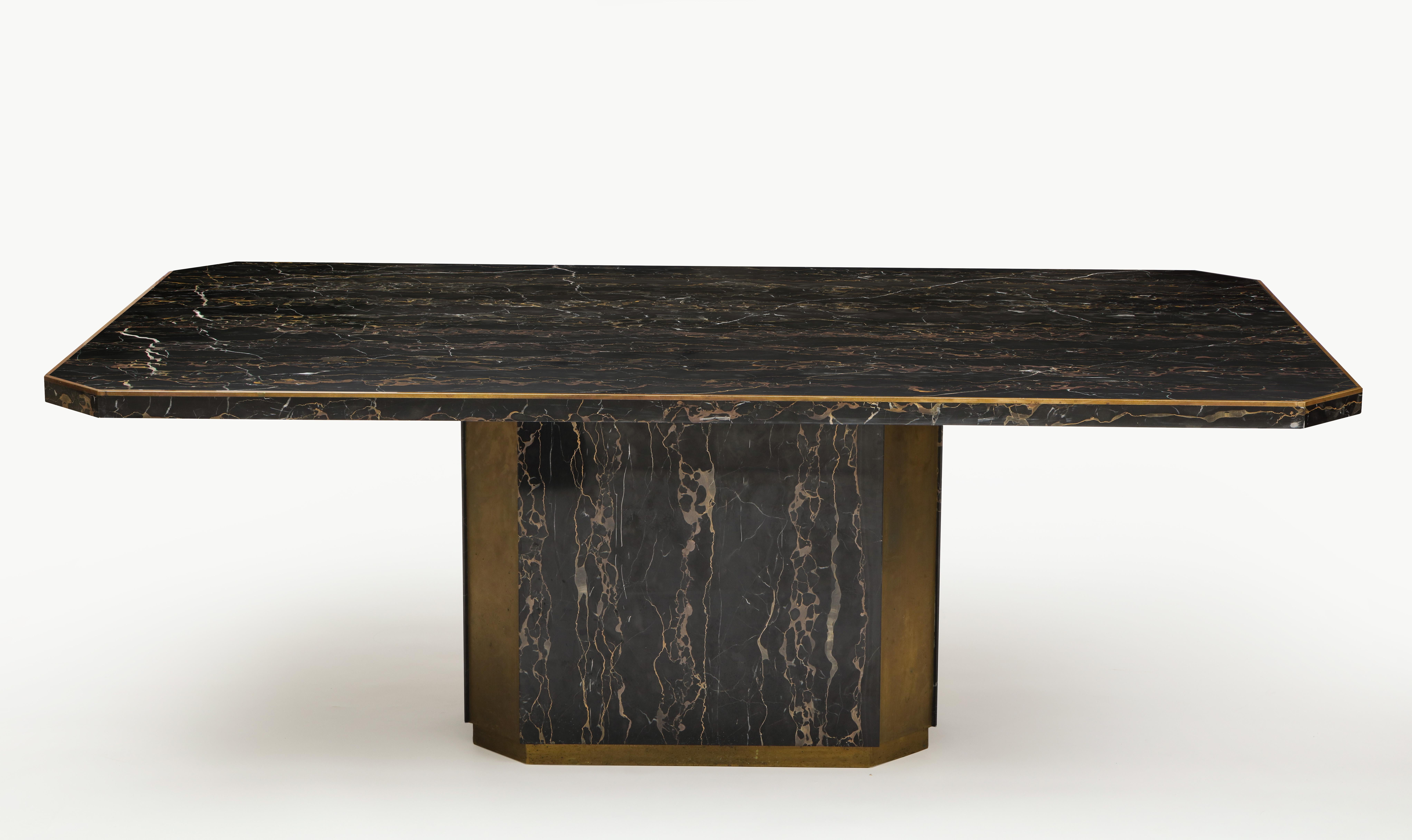Paco Rabanne black Portoro marble dining table bronze detail, France, 1980

Incredible Portoro French marble table. It is signed Paco Rabanne 1982 on the top base area. The bronze detail is incredible. The table comes in two pieces the top and the