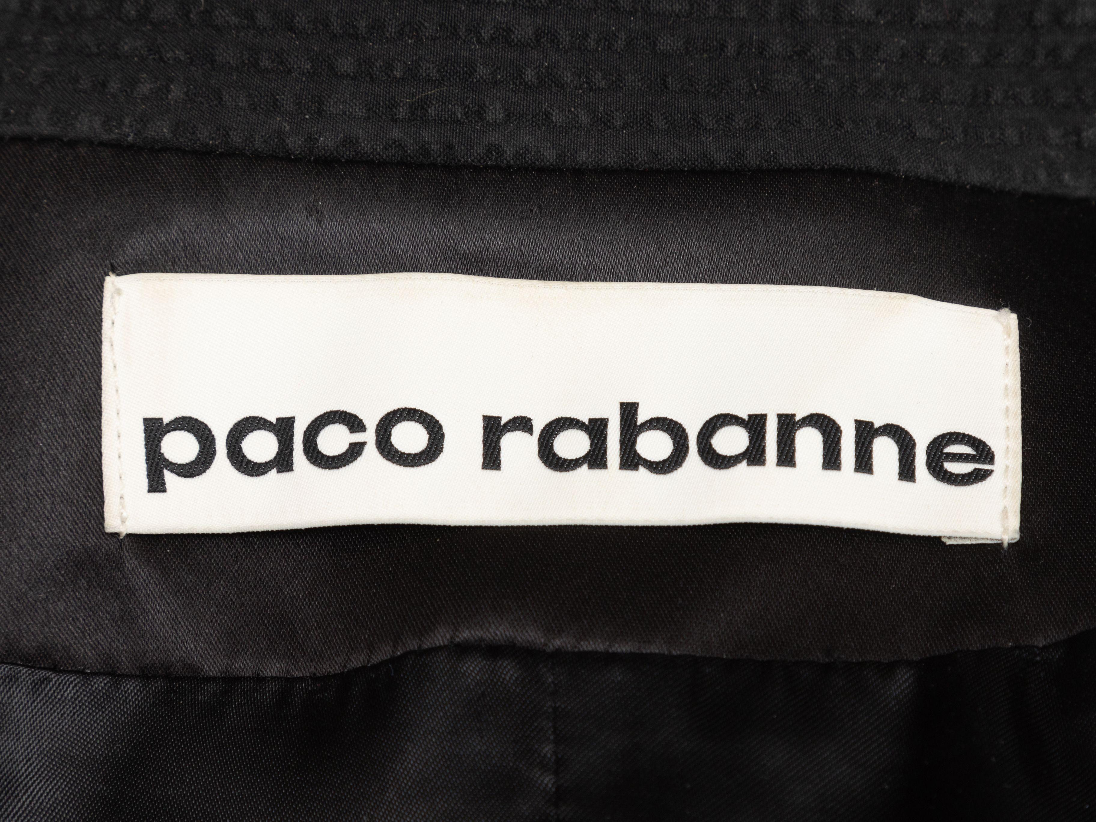 Product Details: Black seersucker blazer by Paco Rabanne. Satin trim throughout. Notched lapel featuring fringe trim. Dual hip pockets. Button closure at front. Designer size 36. 34