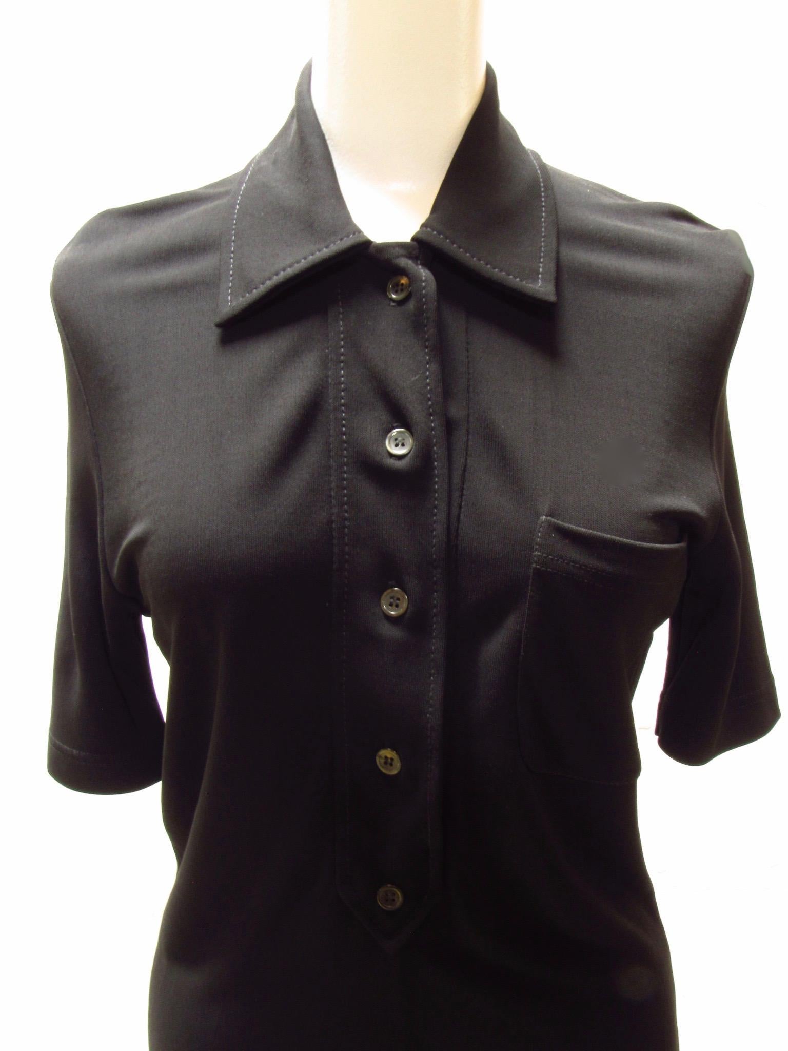 Classic black polo from vintage Paco Rabanne is 100% viscose. IT has one small breast pocket.