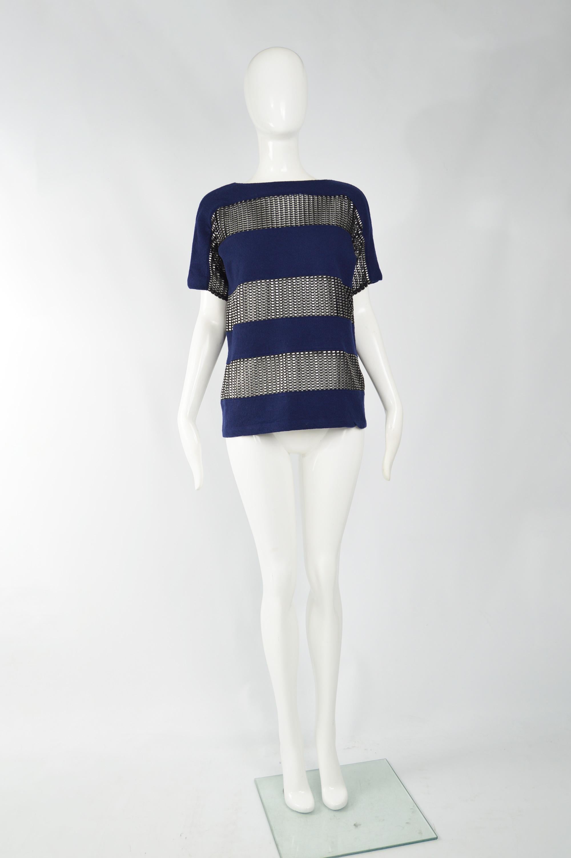 A striking Paco Rabanne women's short sleeve evening shirt in a blue virgin wool with sheer, metallic knit horizontal stripes that adds lots of sex appeal. Perfect for an evening event. 

Size: Marked 38 which is roughly a UK 10/ US 6 which gives a