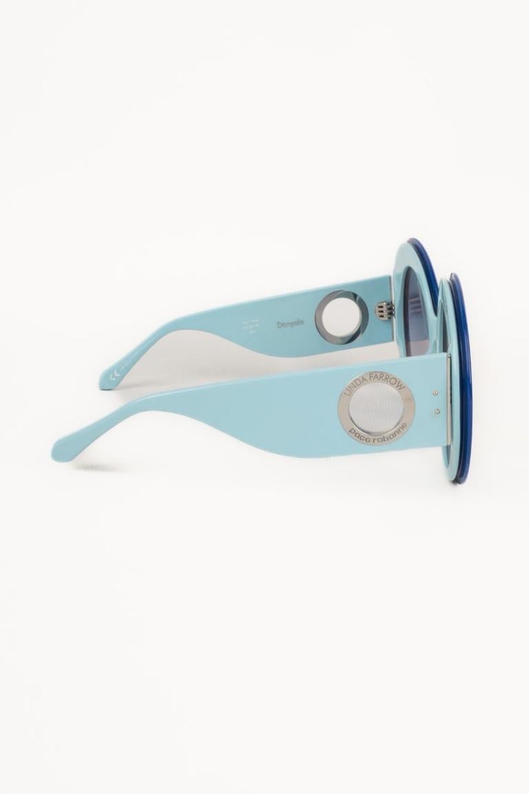 PACO RABANNE - Blue sunglasses by Paco Rabanne x Linda Parrow.

Additional information:
Condition: Very good condition
Dimensions: Width: 17 cm

Seller Reference: ACC89
