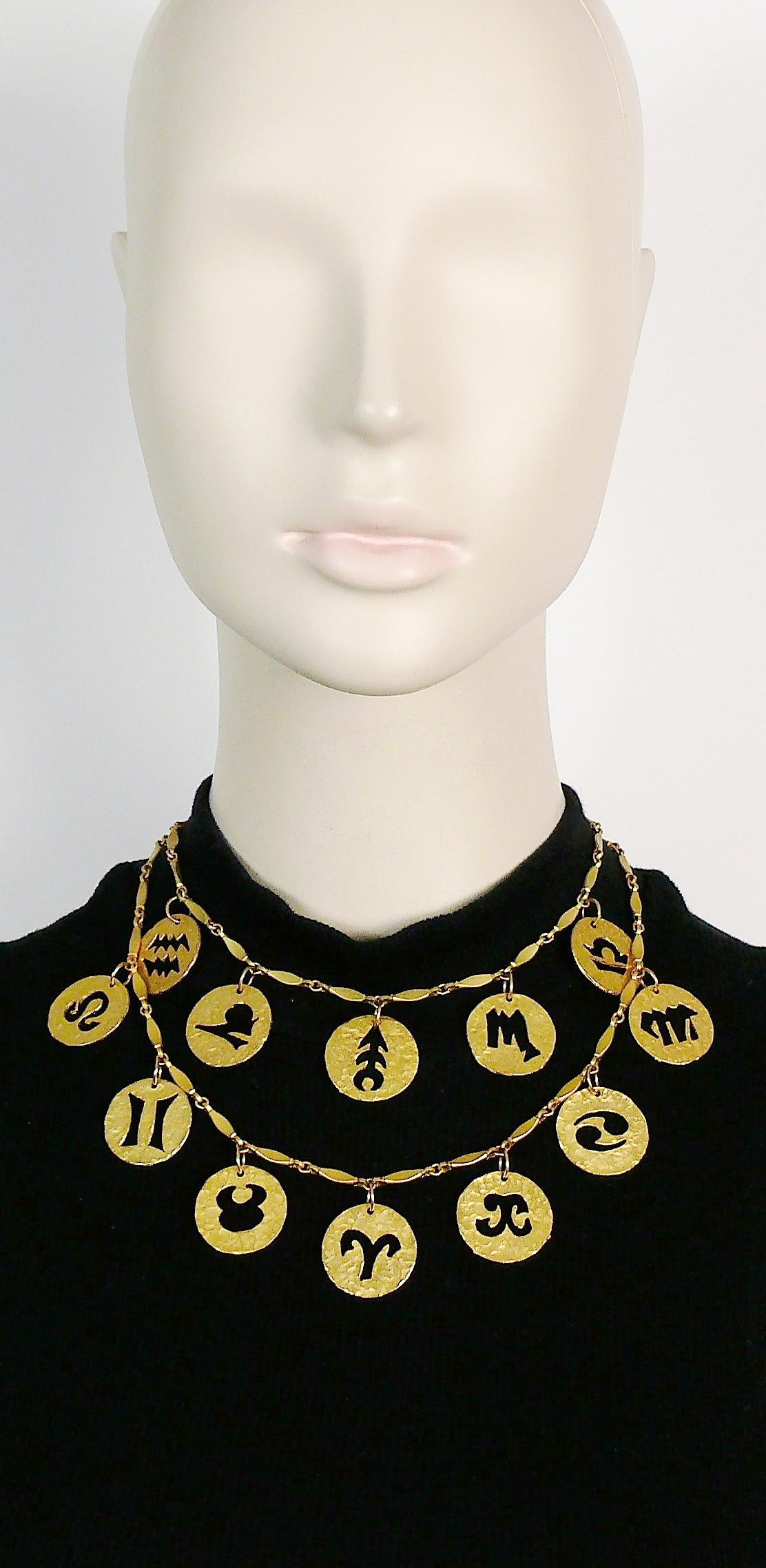PACO RABANNE vintage matte gold toned double strand necklace featuring the 12 zodiac signs.

Created in the ateliers of the MAISON DESRUES in the 1990s.

Lobster clasp closure.

Marked PACO RABANNE Paris.

Indicative measurements : length approx.