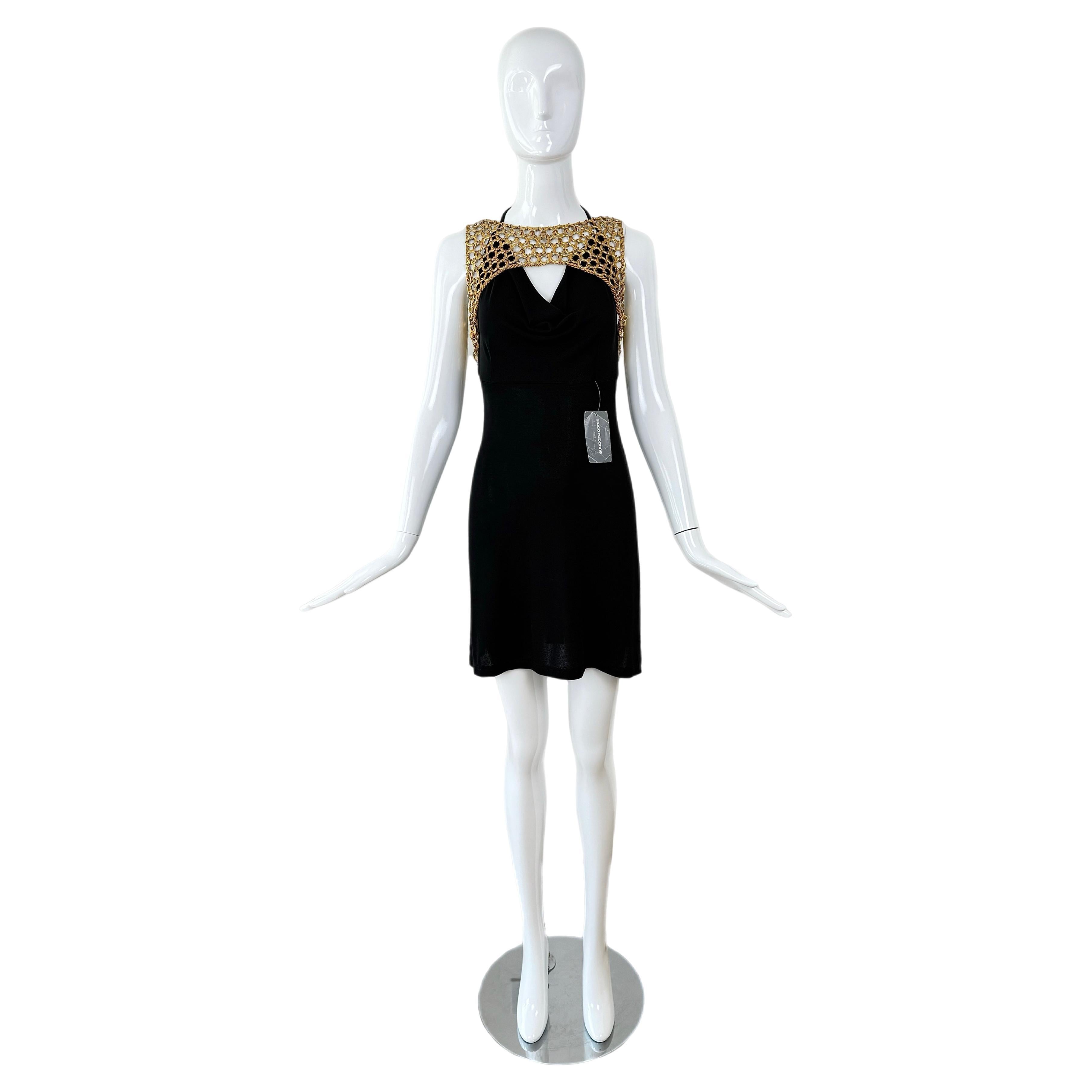 Paco Rabanne
SS95
Lo tengo mal puesto en el maniquí, parece idéntico a la pasarela cuando el cabestro está sobre la cadena
Vintage
Cuello capucha negro azabache con cabestro ajustable
Jersey
Elástico
Oro amarillo + herrajes de color plata
Talla