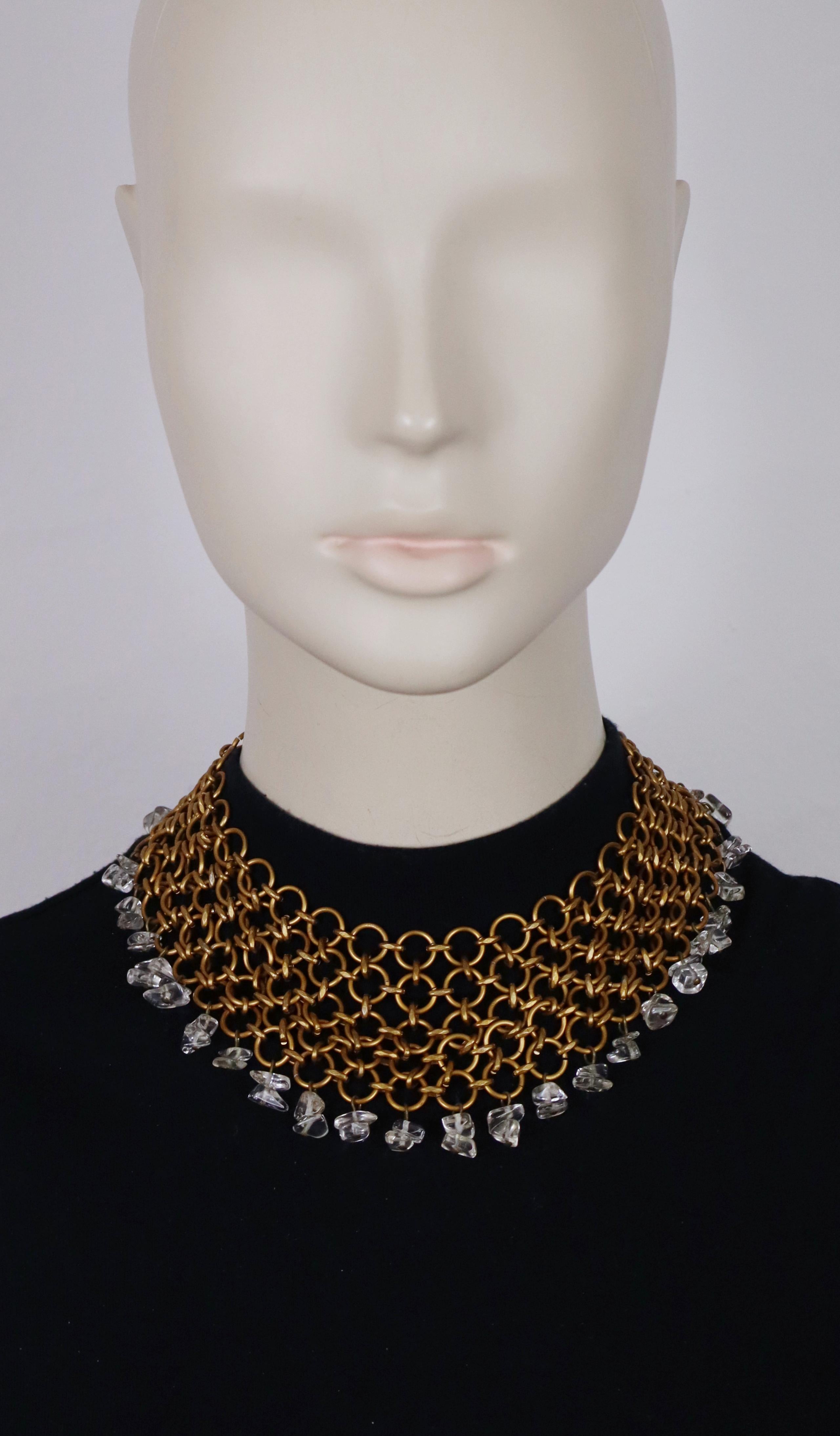 PACO RABANNE vintage necklace showcasing a bronze-tone chainmail grid adorned with dangling clear glass chips.

Lobster clasp.
Adjustable length.

Marked PACO RABANNE Paris.

Indicative measurements : adjustable length from approx. 36 cm (14.17