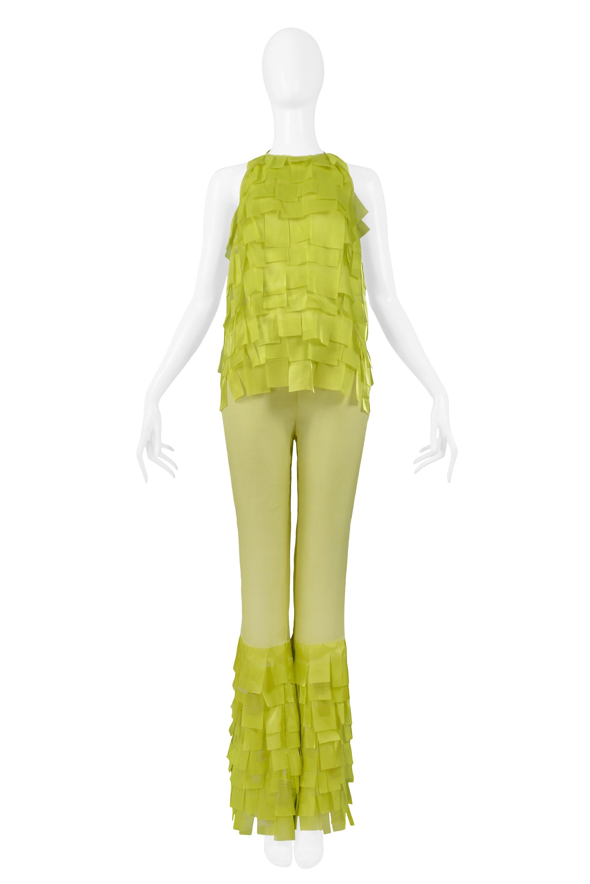 Resurrection Vintage is pleased to offer a vintage Paco Rabanne chartreuse green ensemble with tie back halter top and bell-bottom pants made of silk and embellished with layered vinyl fringe. Collection SS 2001.

Paco Rabanne 
Size Top 40, Pants