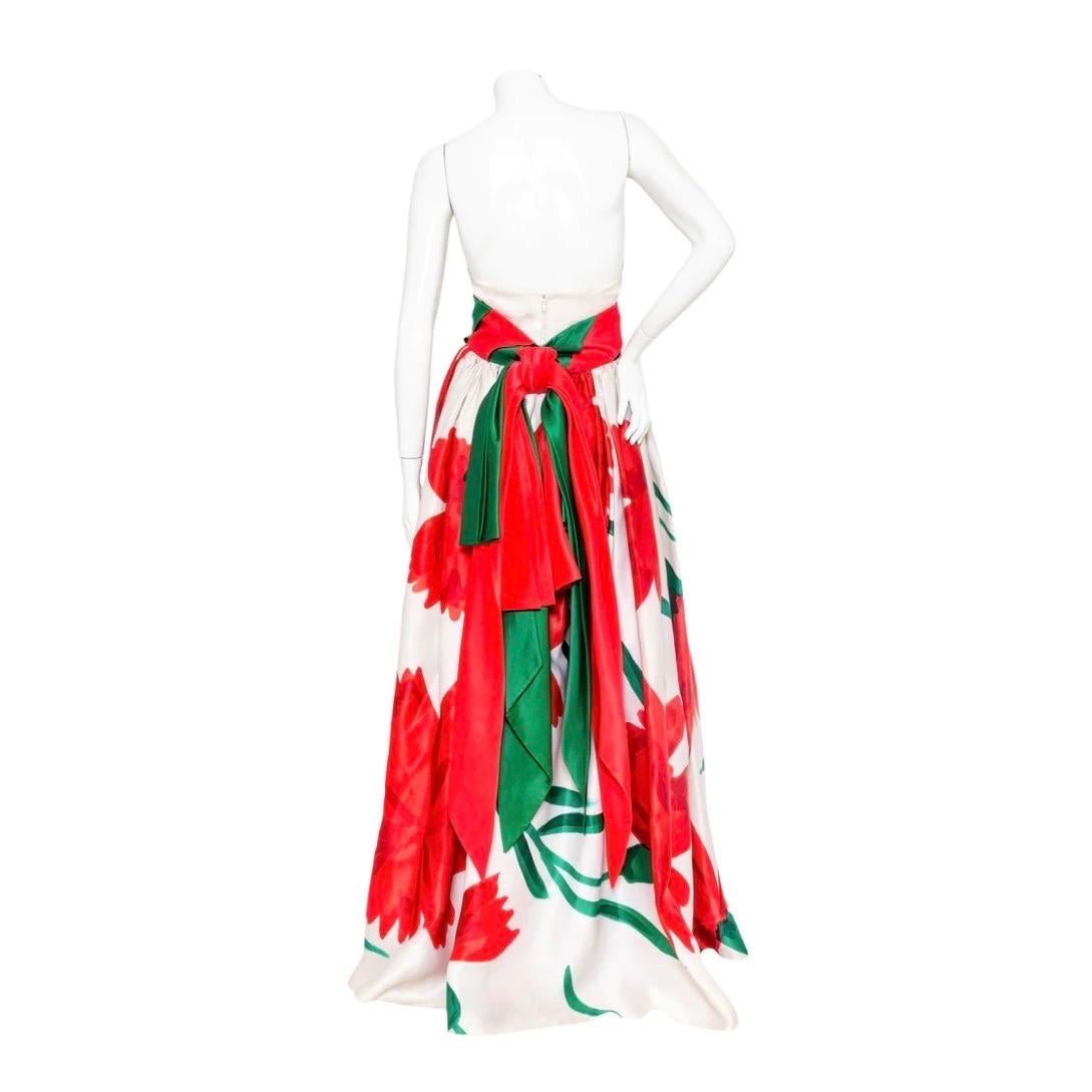 Paco Rabanne Floral and Beaded Sequin Chainmaille 3-Piece Set

Vintage; circa 1980s
3-piece set 
Includes strapless top, skirt, and chainmaille jacket
Skirt features a large scale red and green floral print, and attached diagonal striped wide