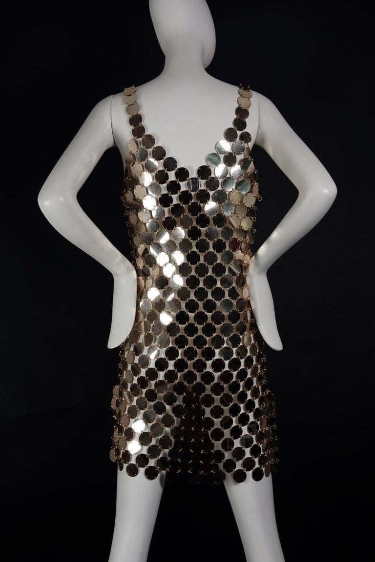 PACO RABANNE Gold Rhodoid Disc Do It Yourself Dress

SIZE: 36/ 38 (mannequin is size 36)

Features:
- The discs are in pale gold tone linked with  jump rings. 
- PACO RABANNE metal tag at the back of the dress.
- Minor surface scratches.
- Very good