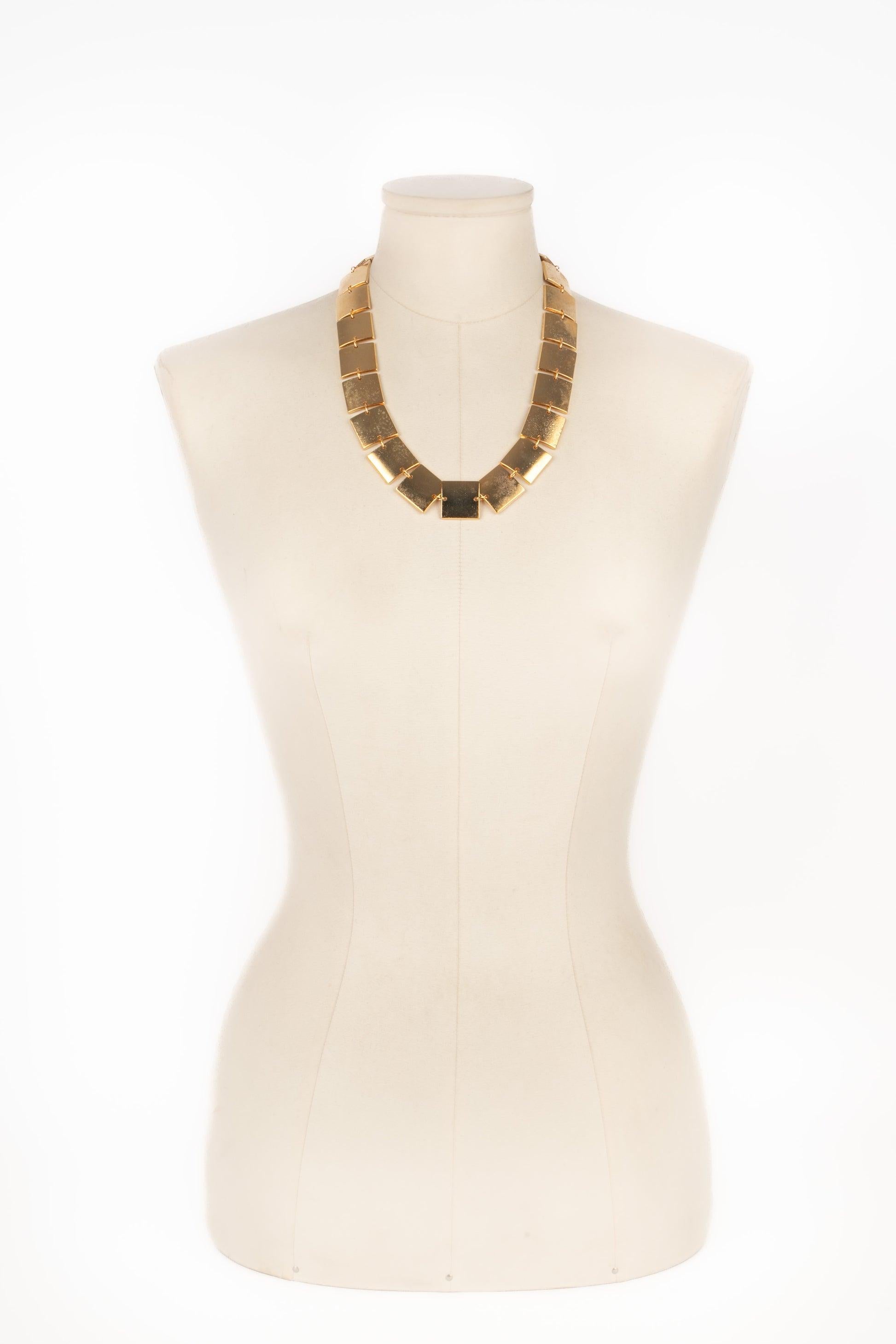 Paco Rabanne - Golden metal necklace made of articulated plates.

Additional information:
Condition: Good condition
Dimensions: Length: from 52 cm to 55 cm

Seller Reference: BC216