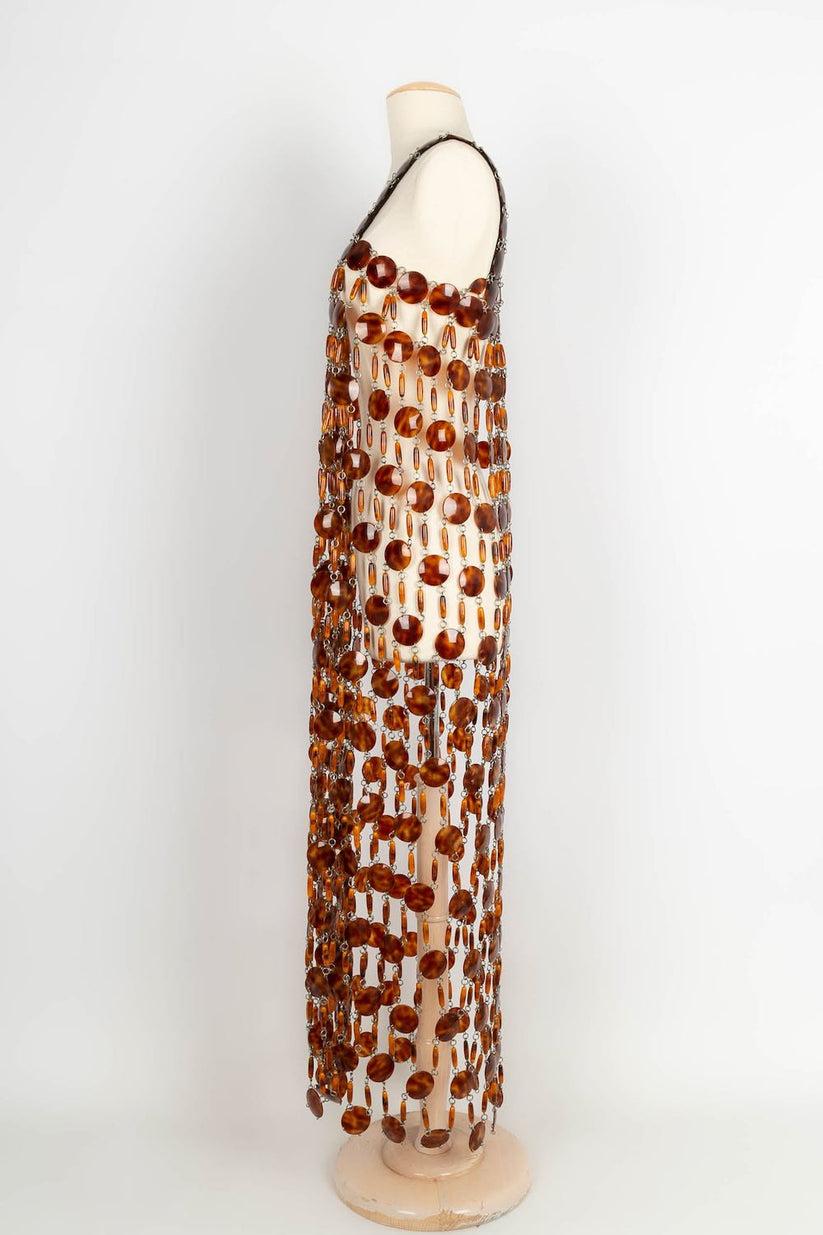 Paco Rabanne -Long dress made of rhodoïd pastilles and patterns. No size indicated, it fits a 36FR.

Additional information: 

Dimensions: 
Chest: 40 cm, Length: 125 cm

Condition: Very good condition

Seller Ref number: VR150