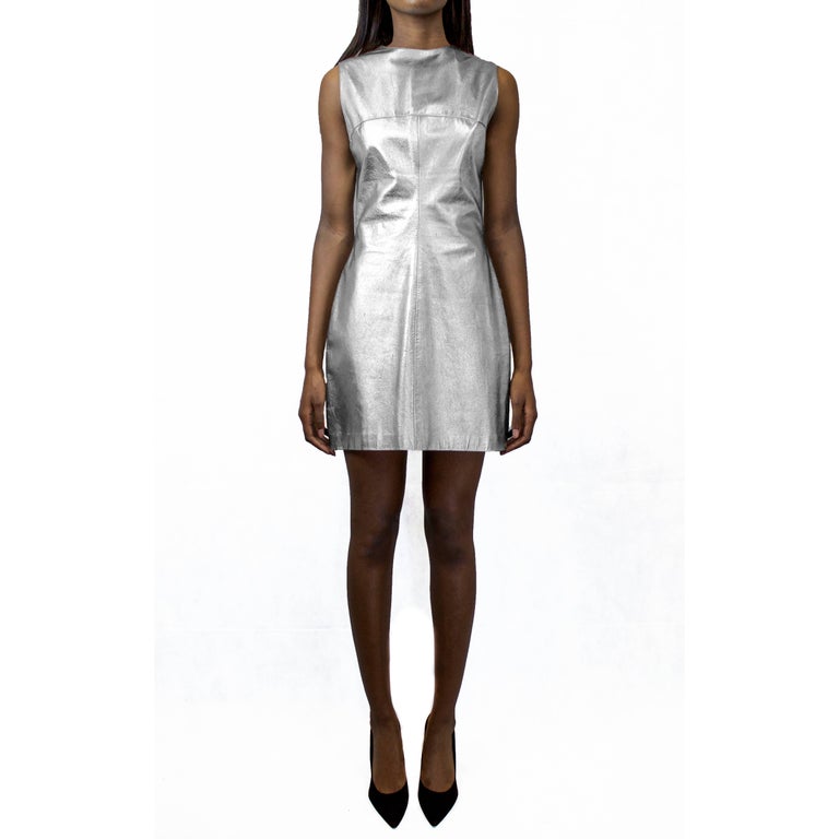 A unique Paco Rabanne piece. Constructed from soft calf leather. The metallic tone of the dress is evocative of the designer’s futuristic aesthetic. Lined in a grey silk-like viscose. Featuring a round neck, no sleeves and a seam running above the