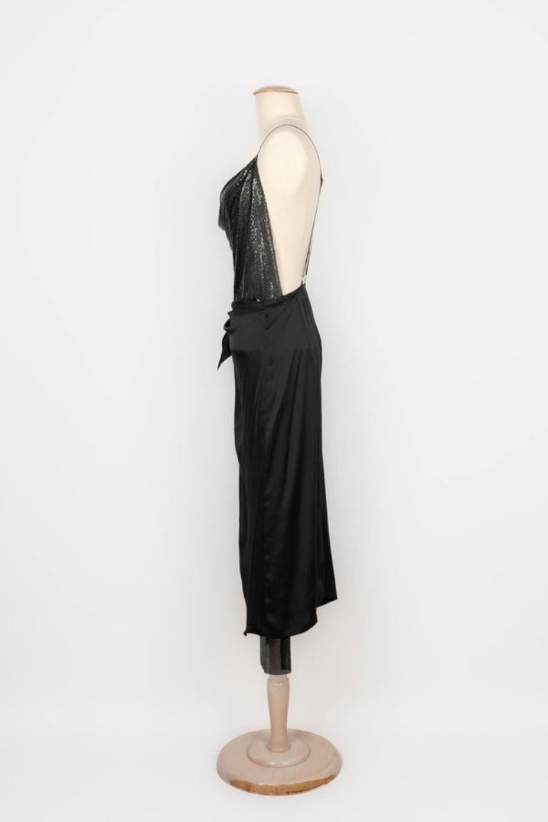Paco Rabanne - Metallic openback dress with a black satin fabric part. Size 36FR. 2019 Spring-Summer Collection.

Additional information: 
Condition: Very good condition
Dimensions: Waist: 36 cm - Length: 125 cm
Period: 21st Century

Seller