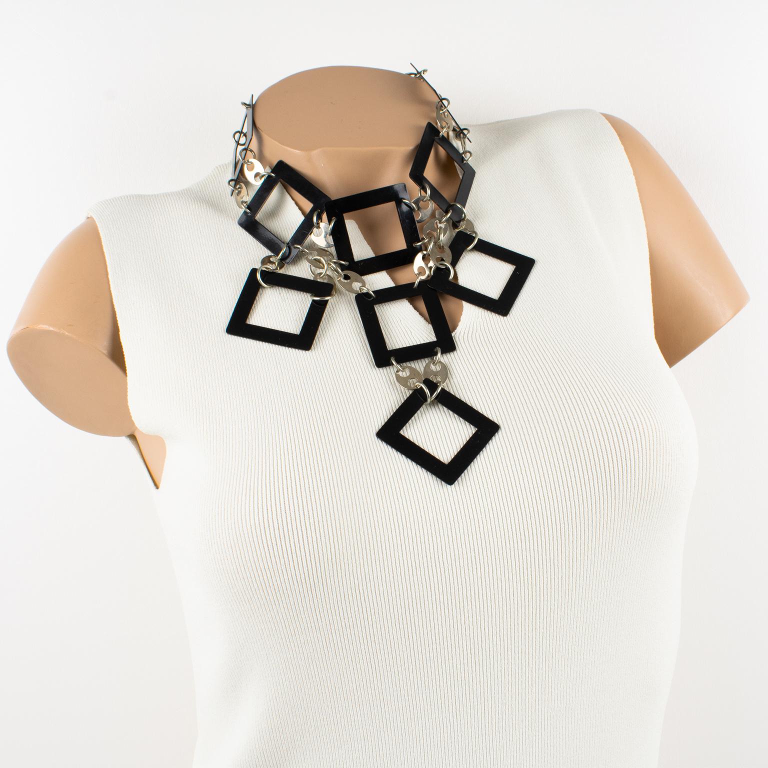 French designer Paco Rabanne, Paris, designed this rare, geometric Space Age necklace. The fabulous piece was crafted in France in the 1960s. This unique, futuristic piece features black enamel metal square links that are built together and