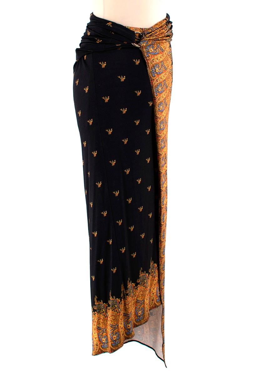 Paco Rabanne Black Wrap Skirt with a Draped Detail 

-Made of soft fresh jersey 
-Wrap style 
-Draped detail to the waist with a golden ring 
-Waist belt 
-Gorgeous yellow and blue pattern trim 

Materilas:
95% viscose, 5 % elastane 

Hand wash