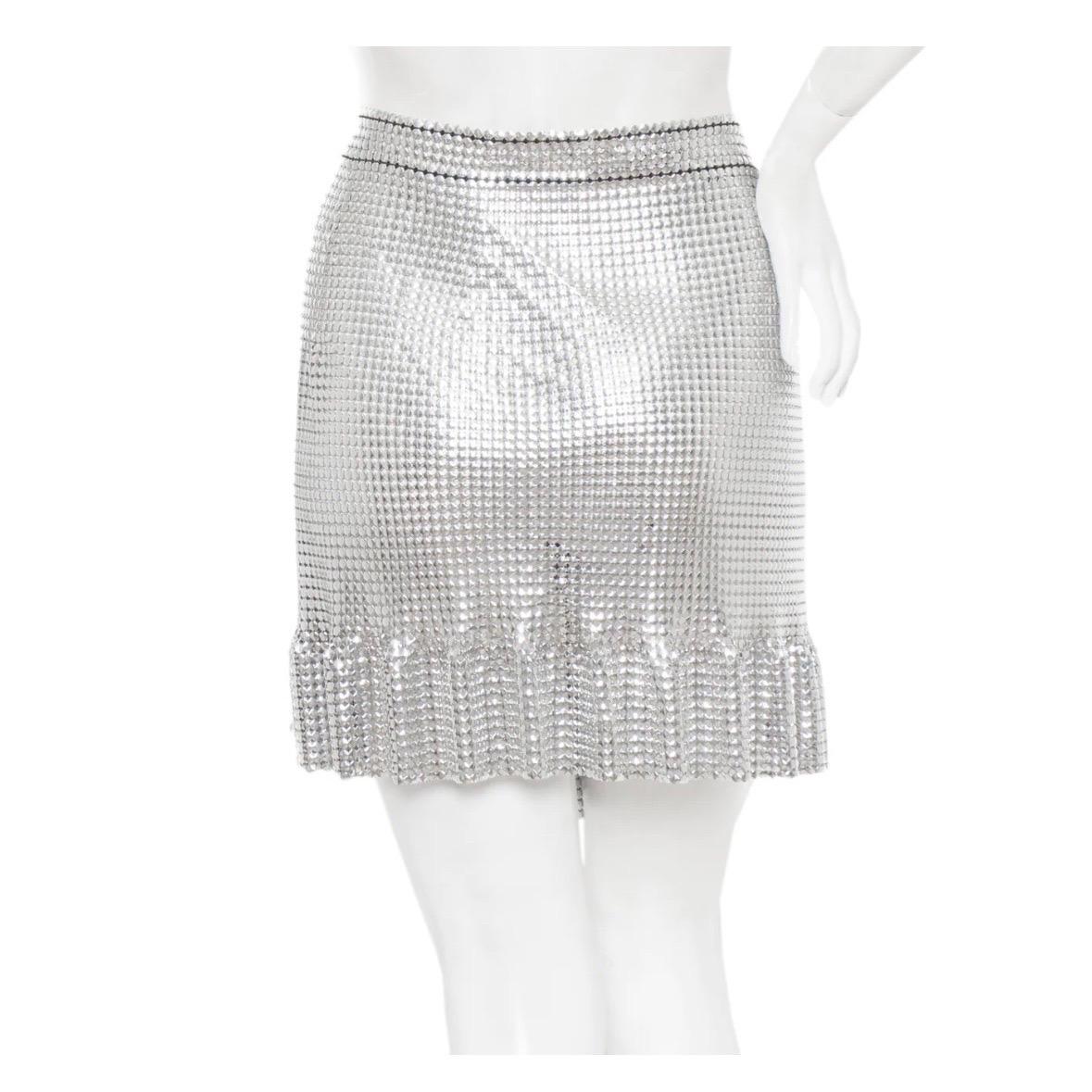 Silver chainmaille mini skirt by Paco Rabanne
2016 Fall Collection
Wrap silhouette with front snap closure
Banded waist 
Ruffled hem
Gripped rubber on waist for extra support
Unlined
Made in France
Condition: excellent
Size/Measurements
