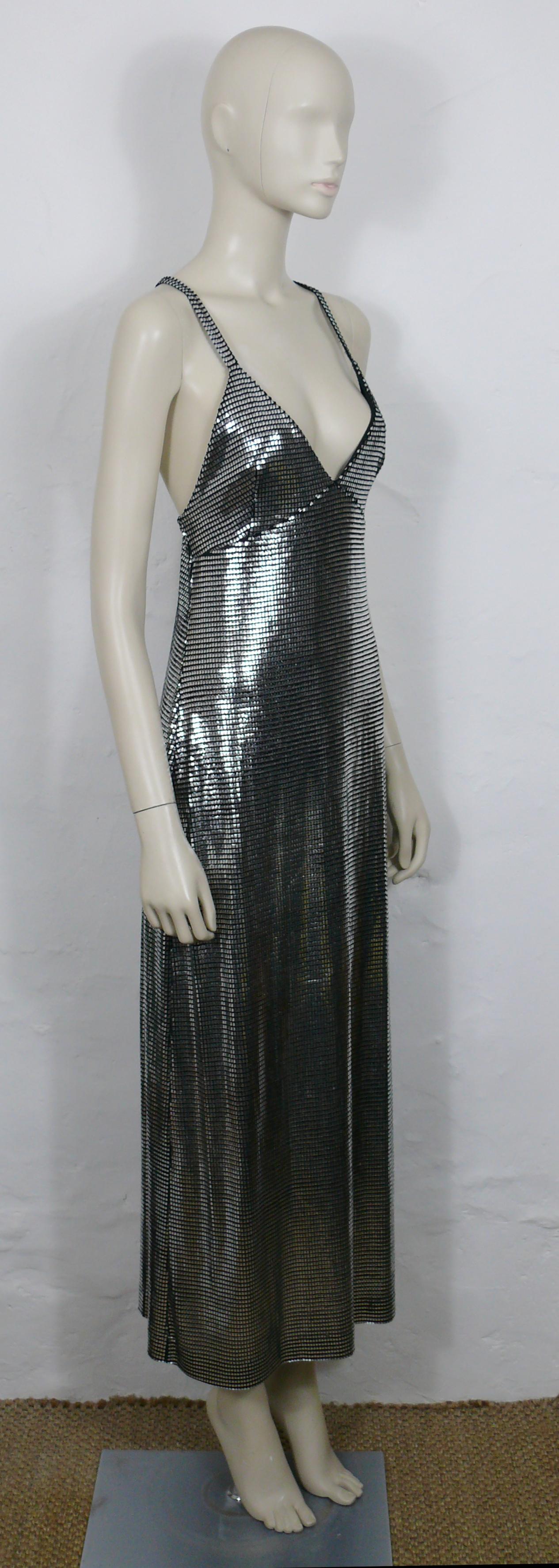 PACO RABANNE silver foil grid maxi dress.

Top surface is silver foil printed creating a metallic chain mail effect on a black knit spandex base.

Bodycon cut.
Ankle length.
Cross back shoulder straps.

Label reads PACO RABANNE Paris.
Made in