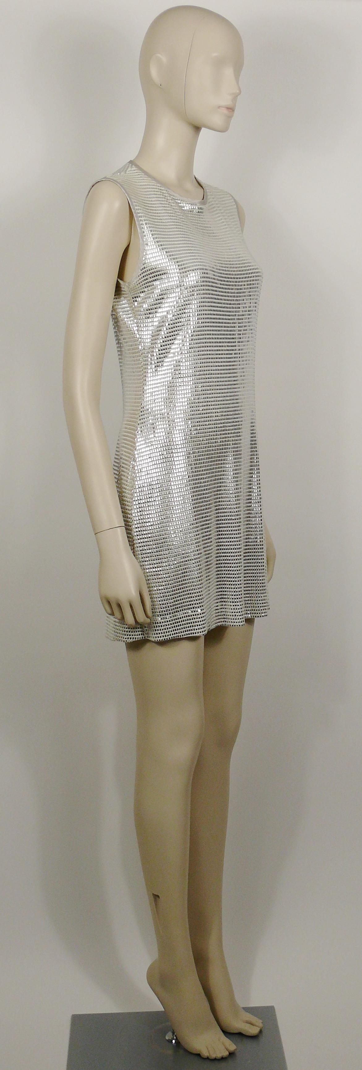 PACO RABANNE white mini dress with silver foil grid.

Top surface is silver foil printed creating a metallic chain mail effect on a white knit spandex base.

Slips on.
Hook neck closure.
Unlined.

Label reads PACO RABANNE Paris.
Made in