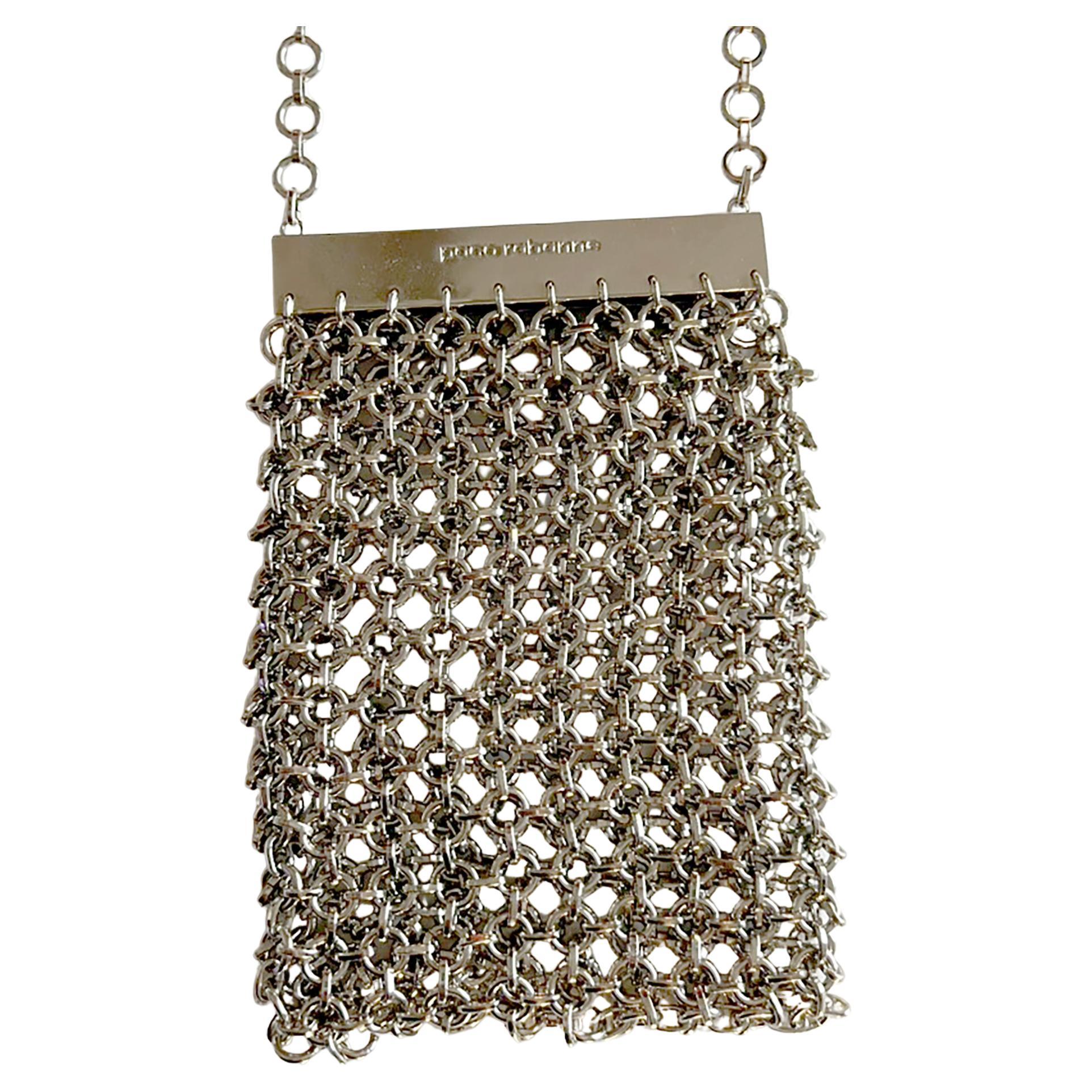 Silver-toned metal chain maille cross body / shoulder bag or necklace with magnetic frame clasp signed Paco Rabanne. Purse measures 6.25