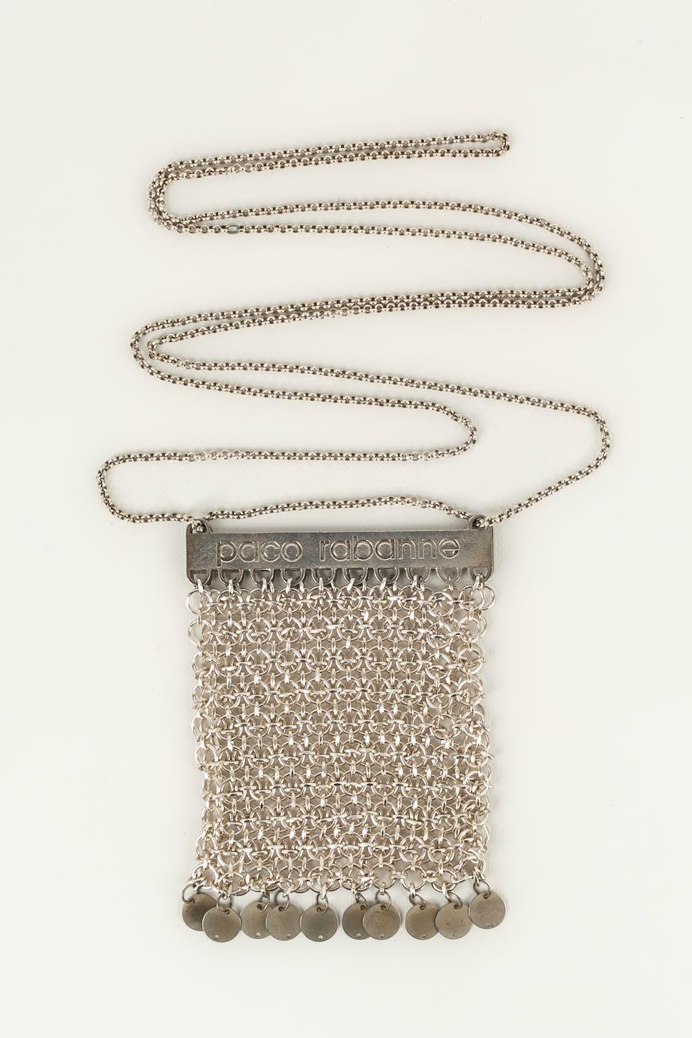 Paco Rabanne - Small flexible bag in silver-plated metal link.

Additional information: 
Dimensions: Height: 14.5 cm, Width: 12.5 cm, Handle: about 180 cm
Condition: Very good condition
Seller Ref number: S166
