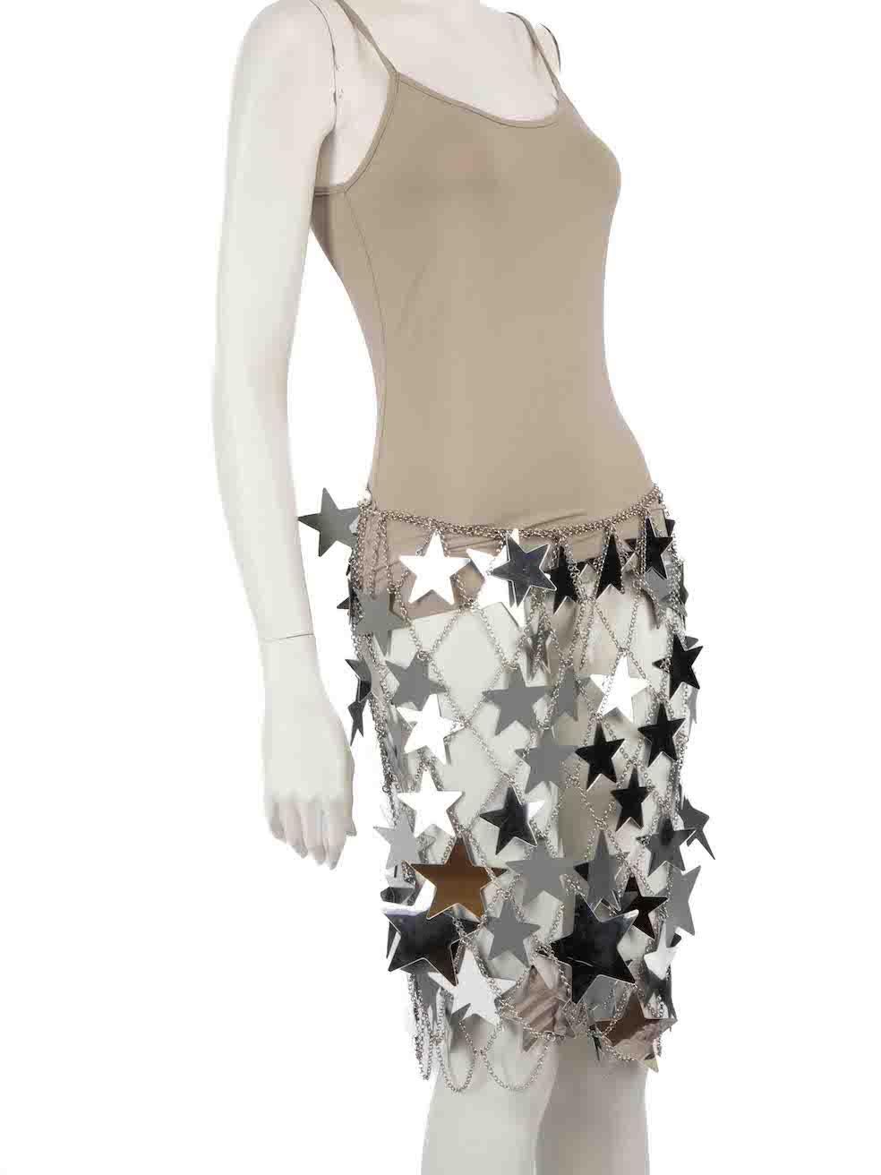 CONDITION is Good. General wear to skirt is evident. Some scratches to the individual stars and a chip to the a star corner near to the right side hem on this used Paco Rabanne designer resale item.
 
 Details
 Silver
 Star mirror chain
 Skirt
