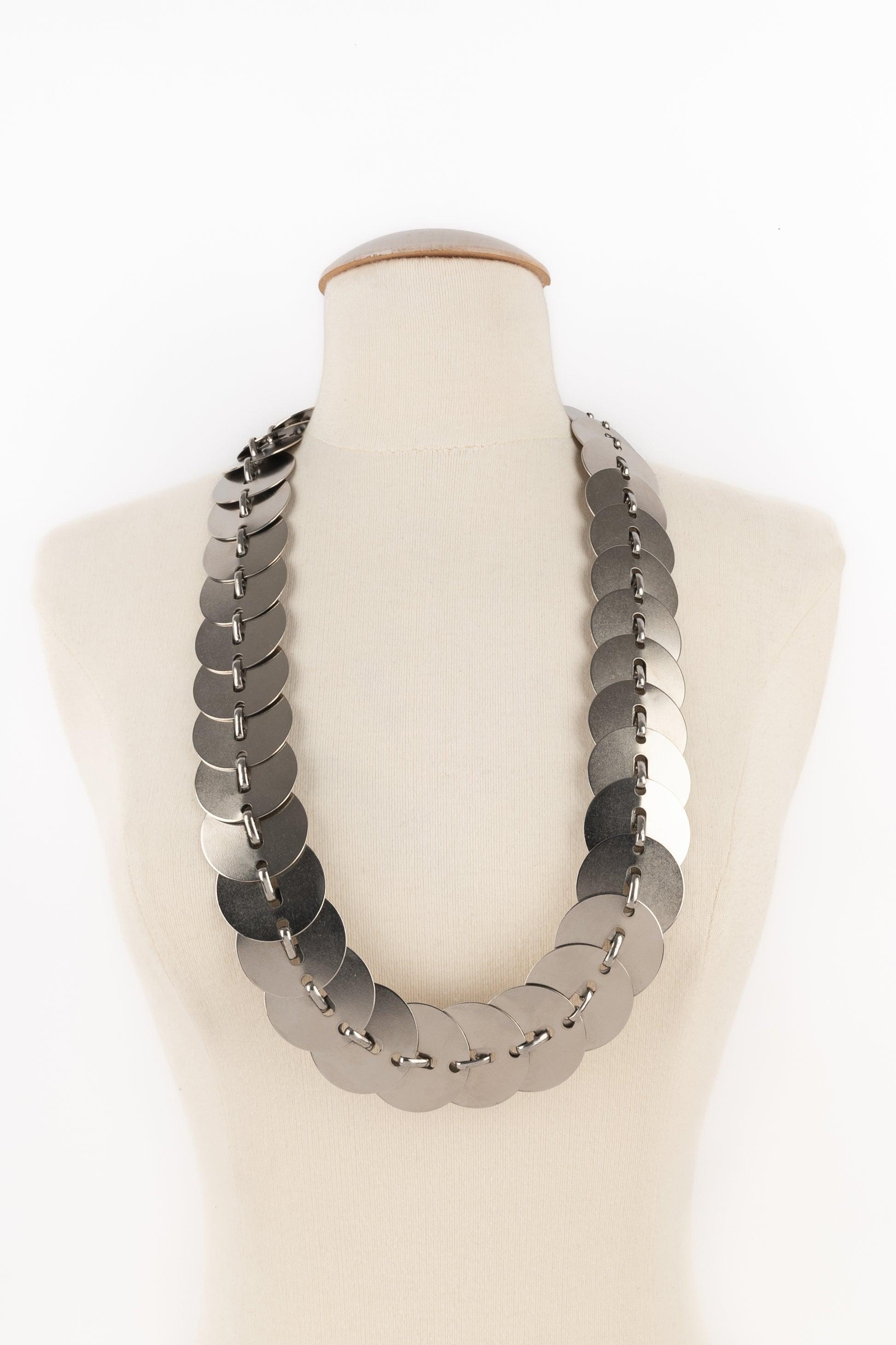 Paco Rabanne - Silvery metal articulated belt. Not signed piece from the 1970s.

Additional information:
Condition: Very good condition
Dimensions: Length: from 77 cm to 85 cm
Period: 20th Century

Seller Reference: ACC259