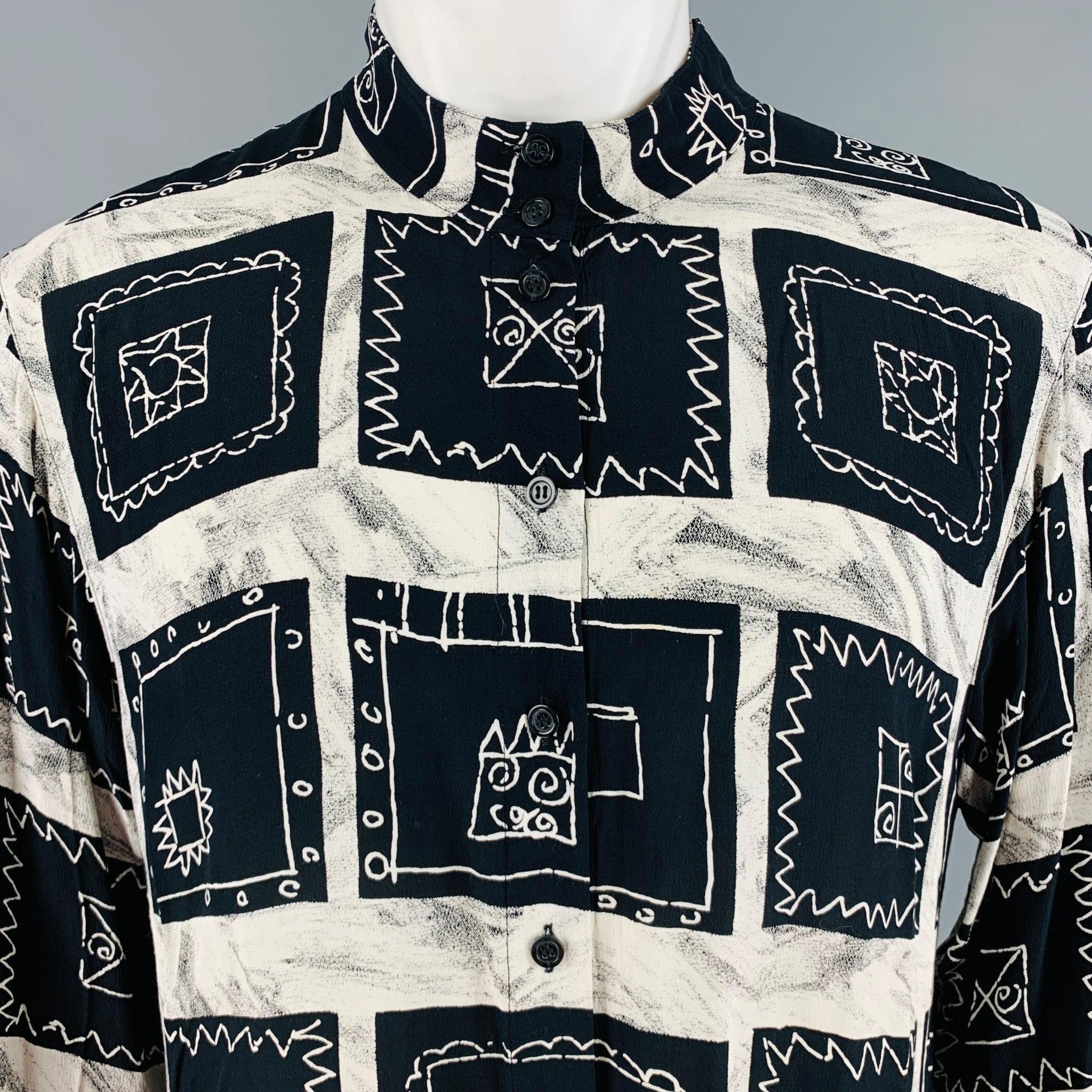 PACO RABANNE long sleeve shirt
in a
black and cream rayon fabric featuring an abstract squares pattern, collarless style, and button closure. Excellent Pre-Owned Condition. 

Marked:   9R 

Measurements: 
 
Shoulder: 17 inches Chest: 38 inches