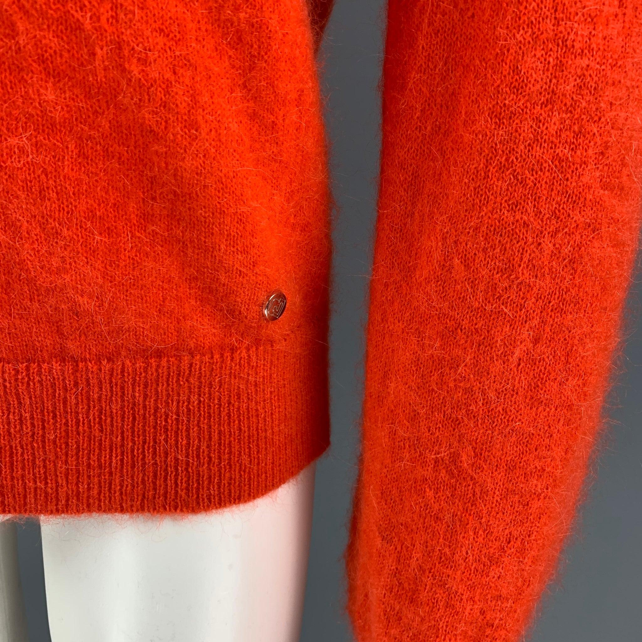 PACO RABANNE sweater comes in a orange mohair blend featuring a turtleneck design.
Excellent
Pre-Owned Condition. 

Marked:   M  

Measurements: 
 
Shoulder: 16 inches Chest:
40 inches Sleeve: 30 inches Length: 25.5 inches 
  
  
 
Reference: