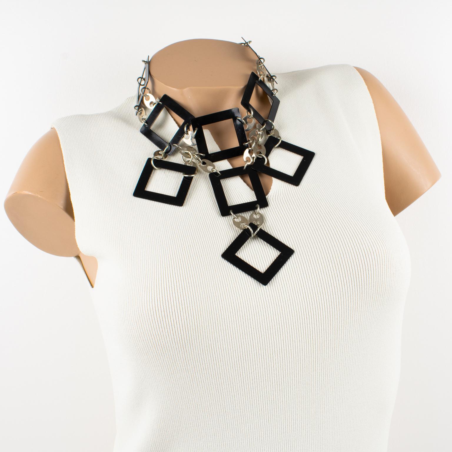 Paco Rabanne, Paris, designed this stunning geometric Space Age chocker necklace circa 1960. The piece features black enamel metal square elements built together and contrasted with chromed metal ovoid beads. The square elements' first raw forms a