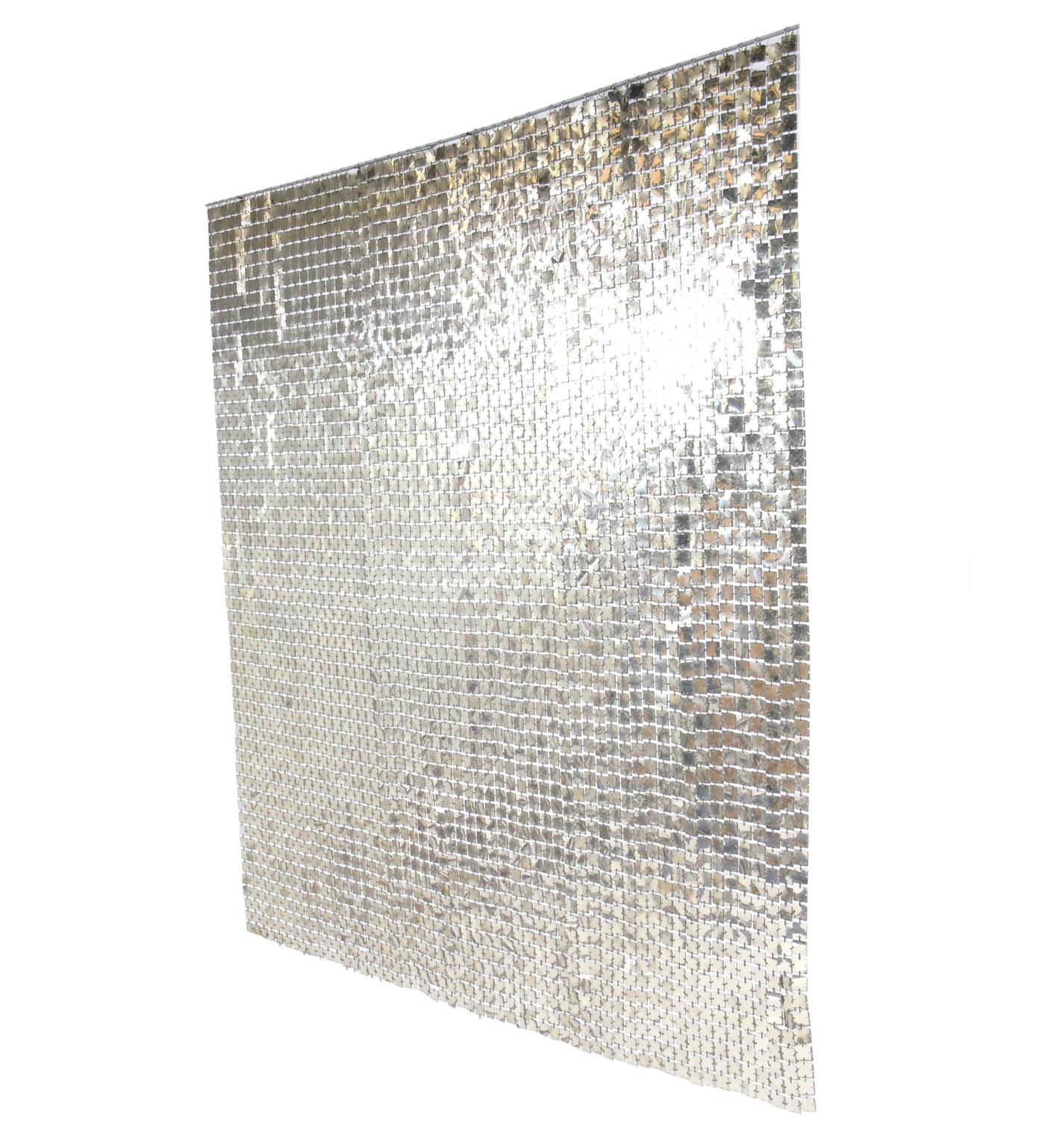 Paco Rabanne space curtain or room divider, French, circa 1970s. It has a wonderful patinated chrome color that looks more platinum in certain light. Looks incredible when lit, as the discs reflect the light and gently move with the slightest breeze.
