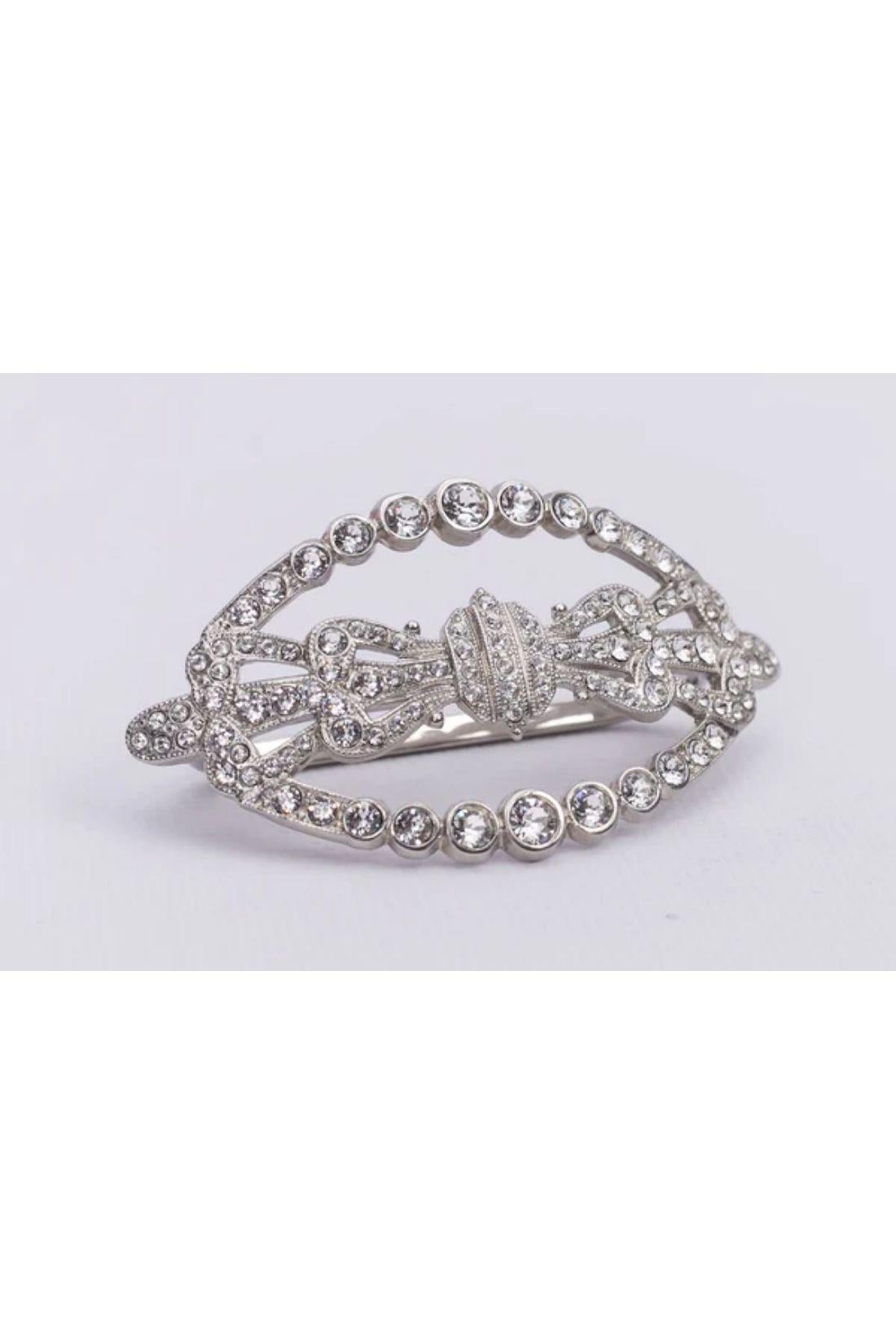 Paco Rabanne - Three-fingers ring in silver-plate paved with rhinestones.

Additional information:

Dimensions:

Ornament: 8 W x 4 H cm (3.15