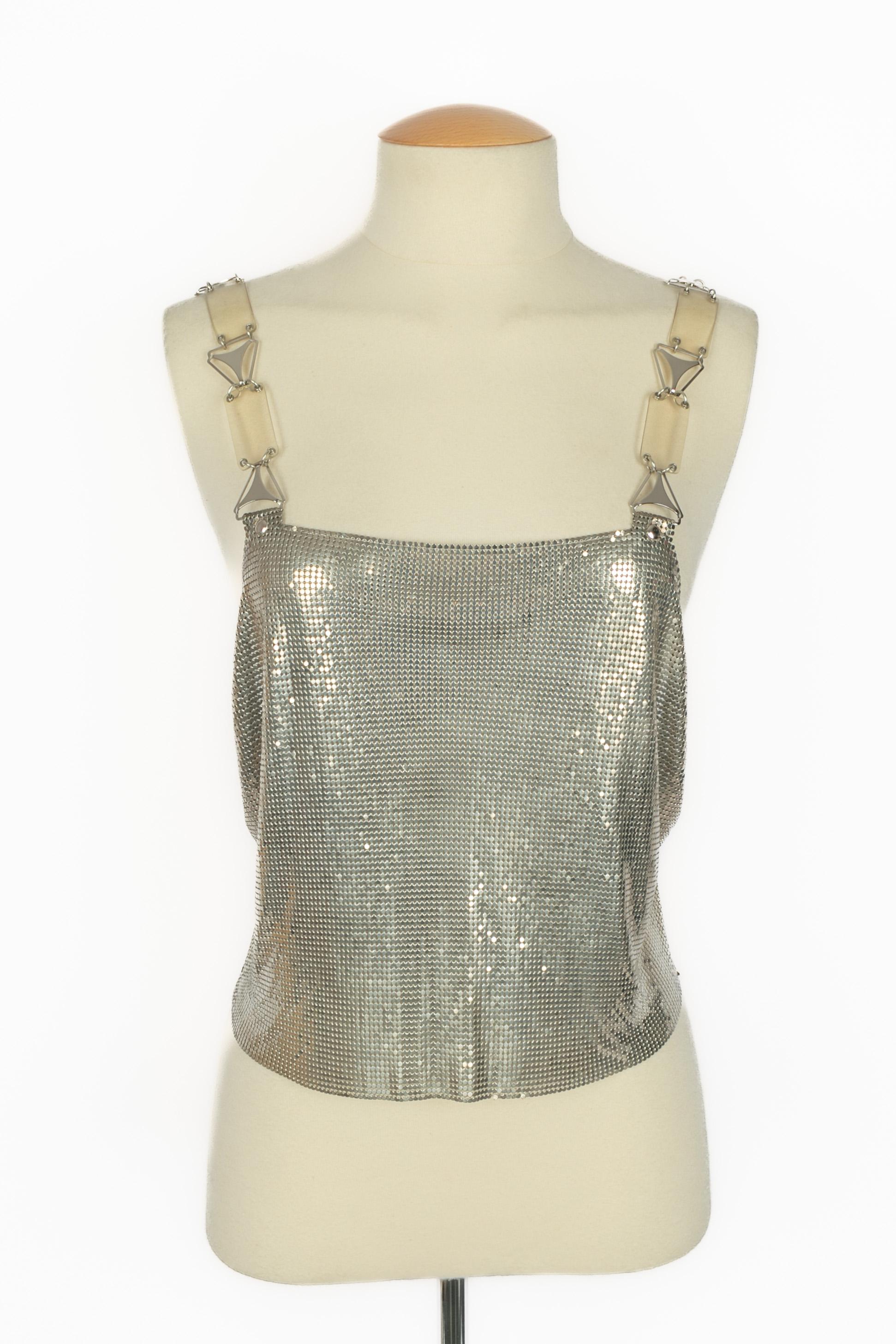 PACO RABANNE - Silvery metallic mesh top with straps made of transparent bakelite and silvery metal. Composition and size labels missing, it fits a 34FR/36FR. 2001 Spring-Summer Collection.

Condition:
Very good condition

Dimensions:
Chest: 45 cm -
