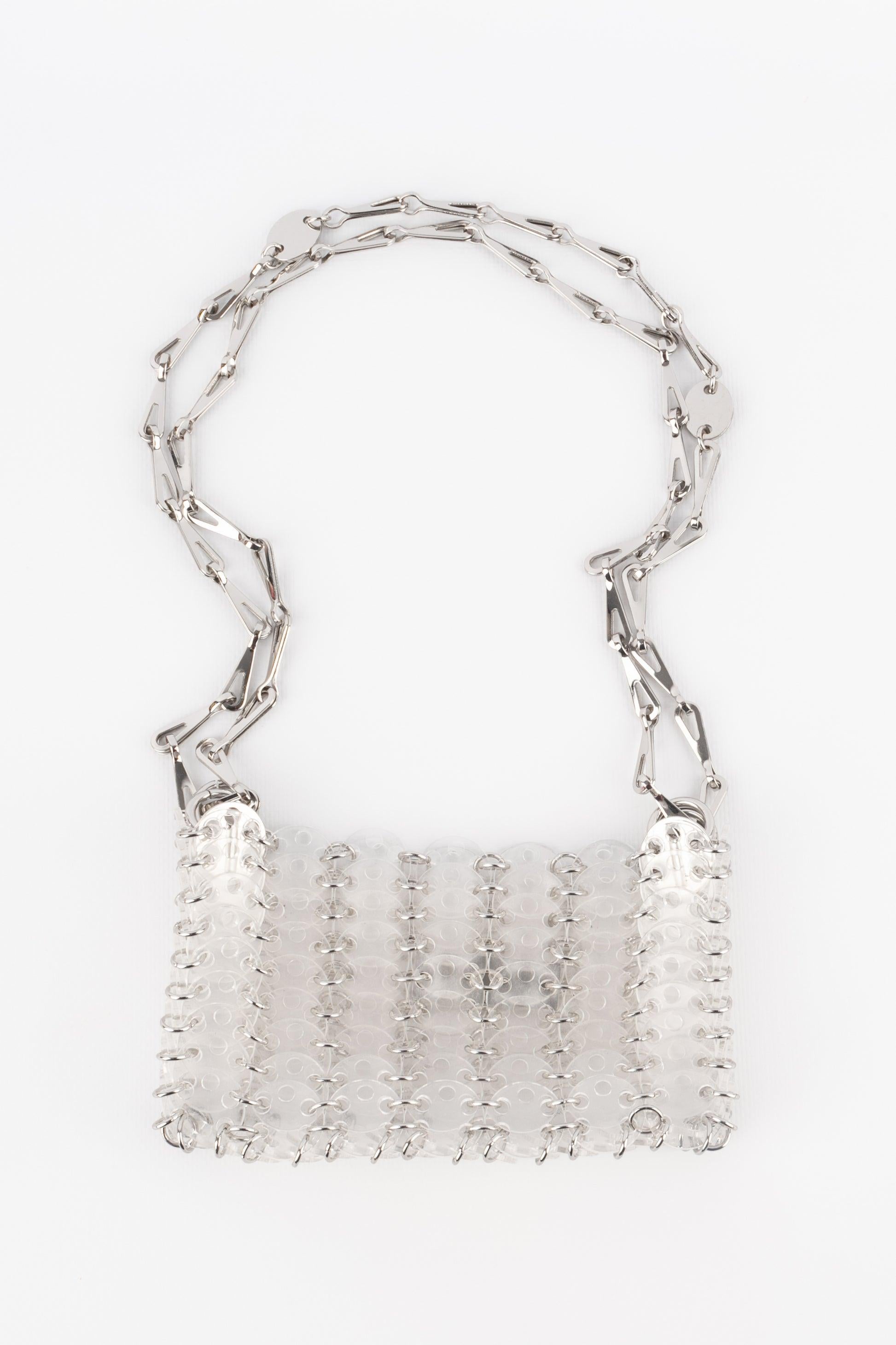 Paco rabanne - Transparent pastille bag. Silvery metal elements.

Additional information:
Condition: Very good condition
Dimensions: Height: 10 cm - Length: 16 cm - Depth: 2.5 cm - Handle: 105 cm

Seller Reference: S266